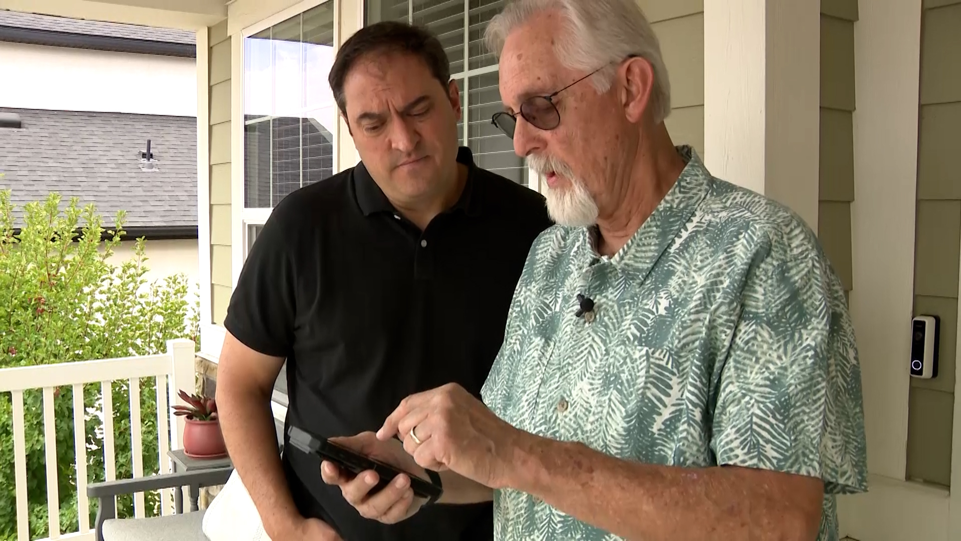 Philip Munoa speaks with Matt Gephardt, Tuesday. Munoa's car got hit by a rock he says was kicked up by a dump truck in front of him.