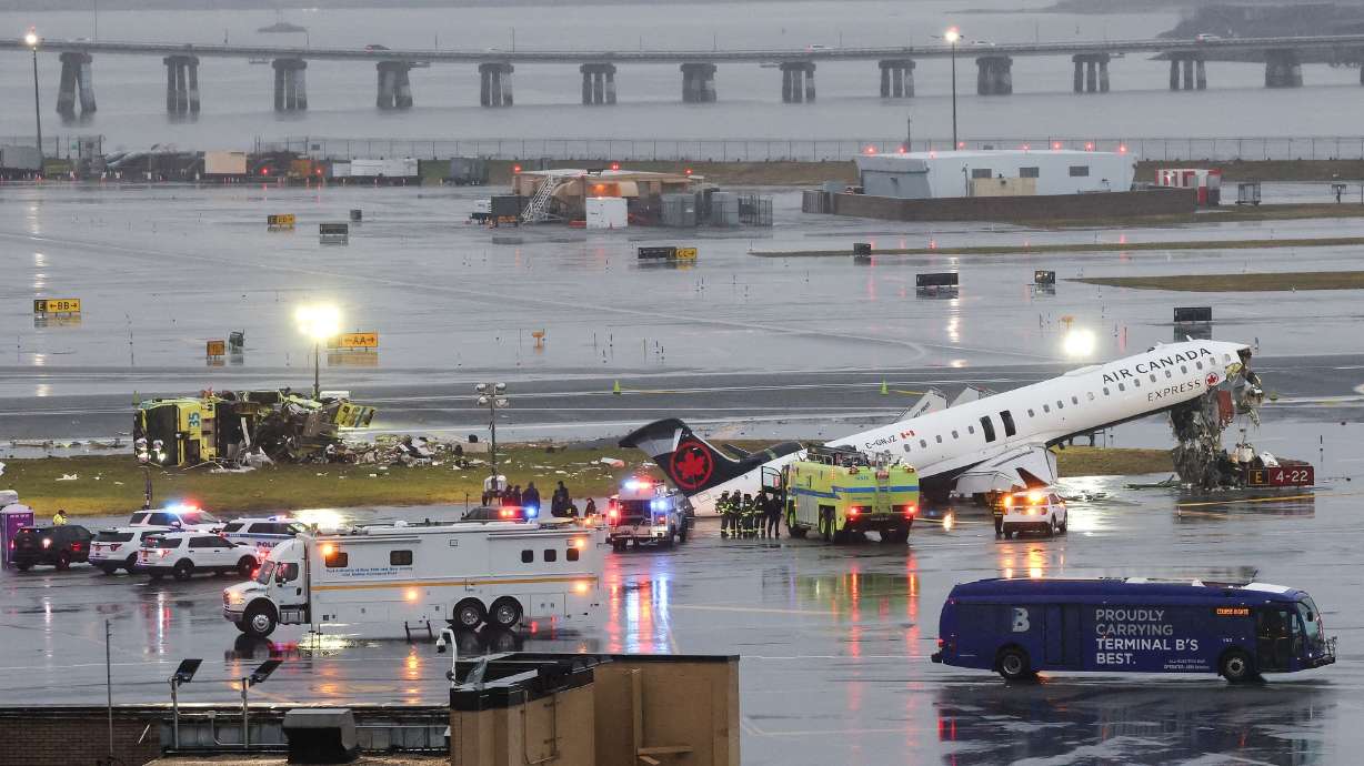 The wreckage of an Air Canada Express regional jet sits near the runway after colliding with a Port Authority fire truck at LaGuardia Airport on March 23. Air traffic controllers at the airport reportedly left work early that night.