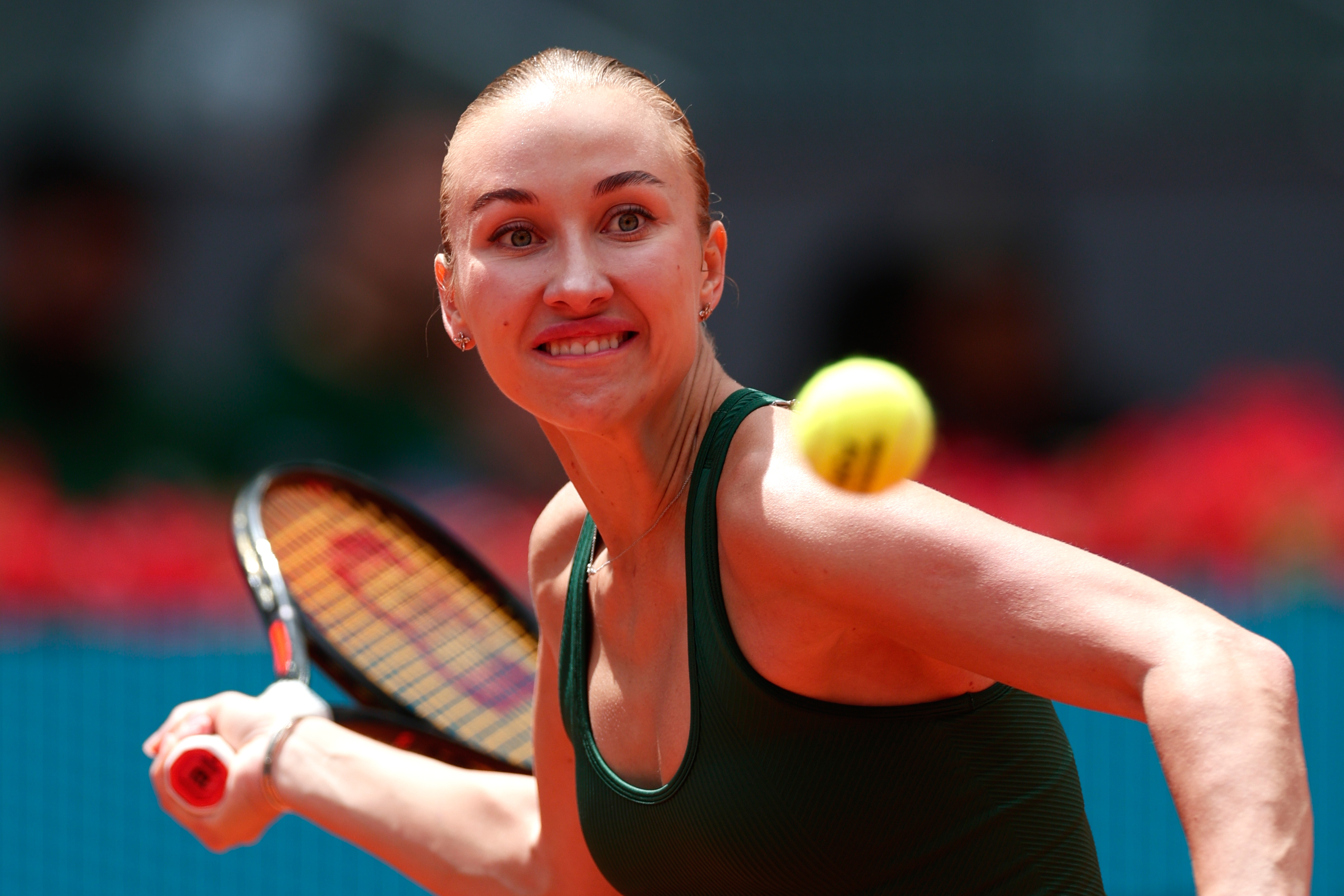 Anastasia Potapova of Russia returns the ball to Karolina Pliskova of the Czech Republic during the Madrid Open tennis tournament in Madrid, Wednesday, April 29, 2026. 