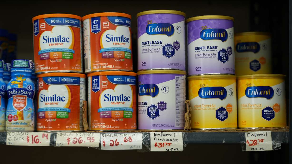 Canisters of infant formula are priced as high as $31.75 per 12.4-ounces at a market serving the Central American immigrant community in the Westlake/Pico Union area of Los Angeles, April 7. Federal health officials said Wednesday a new analysis found infant formula is safe.