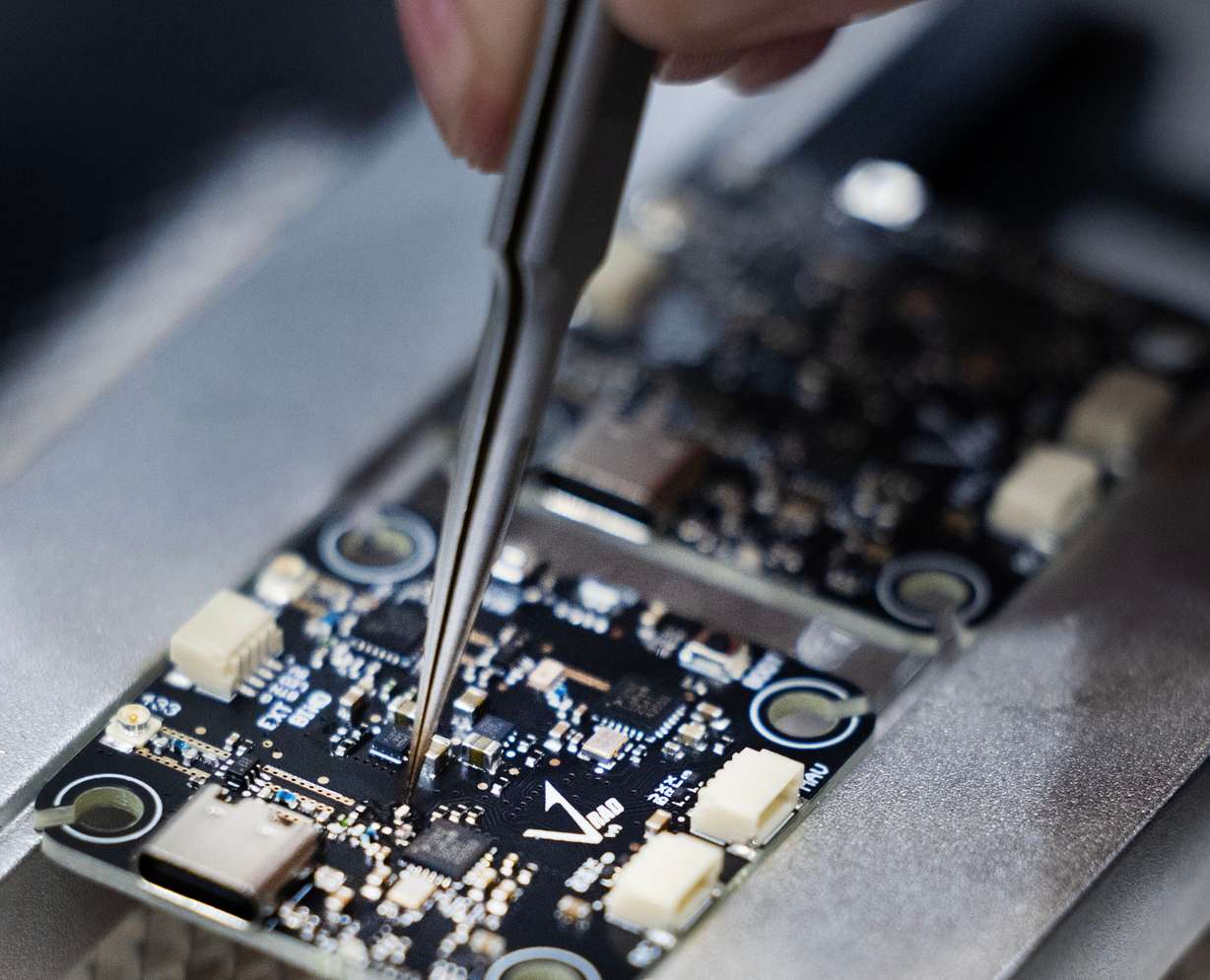 Internal components of a proprietary Vector radio are soldered at Vector in Bluffdale on Friday.