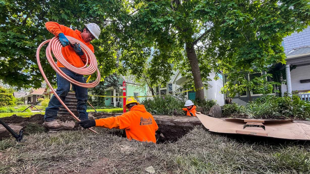 Excavation crews prepare to install a copper service line underneath the front yard of Spencer Hogan's Salt Lake City home on Wednesday. It's the first line replacement from Salt Lake City Department of Public Utilities' Lead and Copper Program.