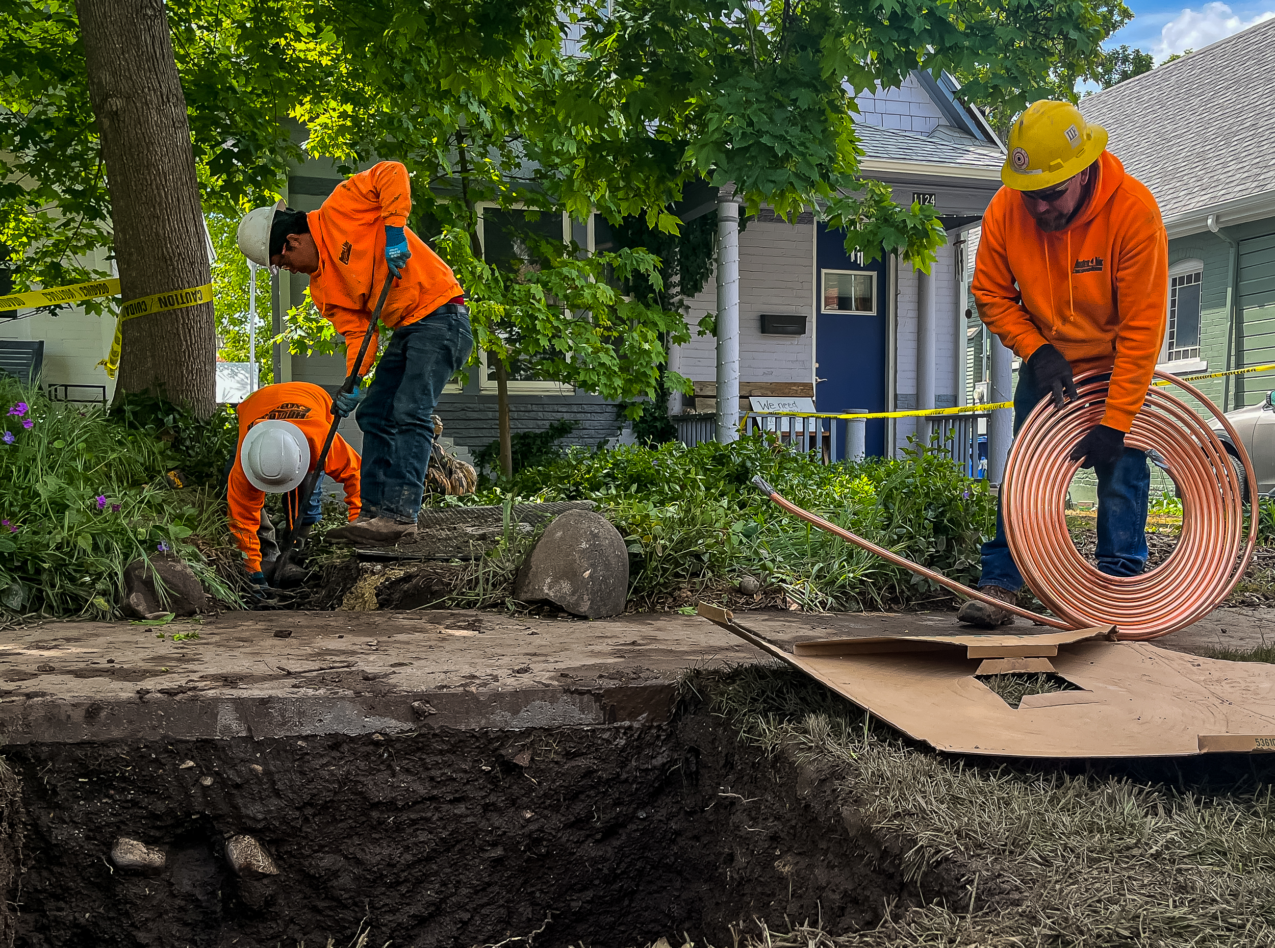 Excavation crews prepare to install a copper service line underneath the front yard of Spencer Hogan's Salt Lake City home on Wednesday. It's the first line replacement from Salt Lake City Department of Public Utilities' Lead and Copper Program.