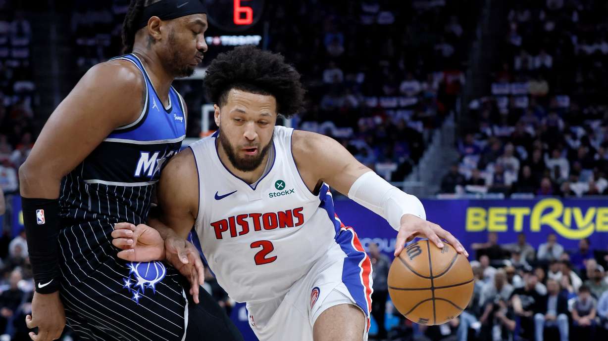 Detroit Pistons guard Cade Cunningham (2) drives against Orlando Magic center Wendell Carter Jr. (34) during the first half in Game 5 of a first-round NBA basketball playoffs series Wednesday, April 29, 2026, in Detroit.