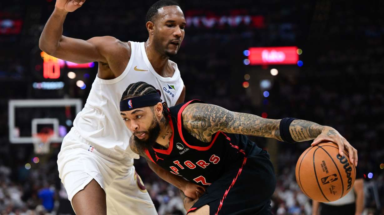 Toronto Raptors forward Brandon Ingram drives on Cleveland Cavaliers center Evan Mobley during the first half in Game 5 of a first-round NBA playoffs basketball series, Wednesday, April 29, 2026, In Cleveland.