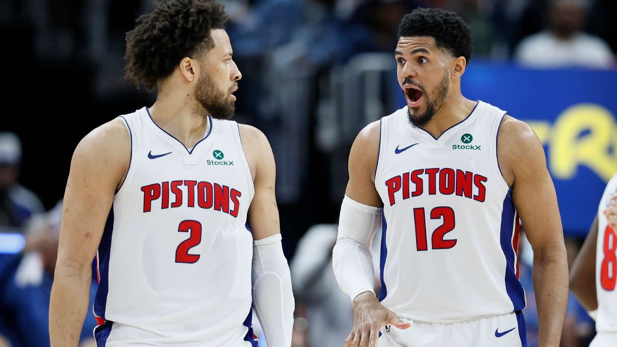 Detroit Pistons forward Tobias Harris (12) reads to a basket scored against the Orlando Magic by guard Cade Cunningham (2) during the second half in Game 5 of a first-round NBA basketball playoffs series Wednesday, April 29, 2026, in Detroit.