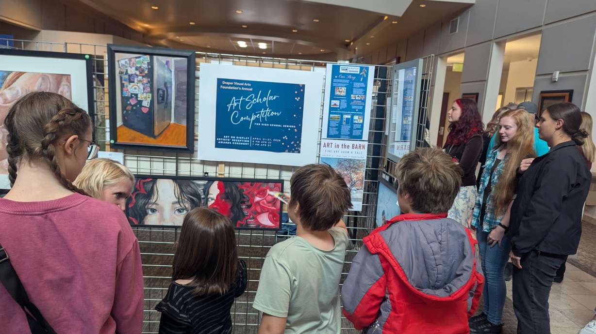 People view student art on Monday at an exhibit inside Draper City Hall, ahead of the Draper Arts Visual Foundation's annual award ceremony.