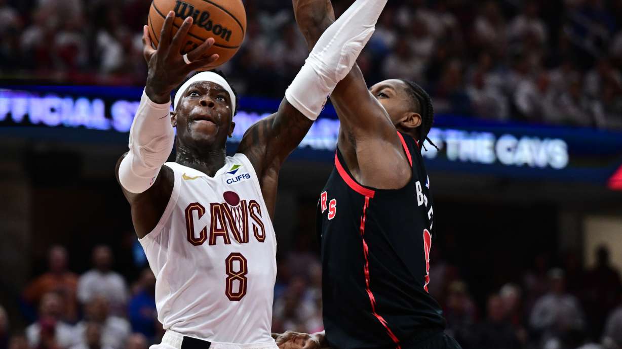 Cleveland Cavaliers guard Dennis Schroder goes to the basket against Toronto Raptors forward RJ Barrett during the second half in Game 5 of a first-round NBA playoffs basketball series, Wednesday, April 29, 2026, In Cleveland.