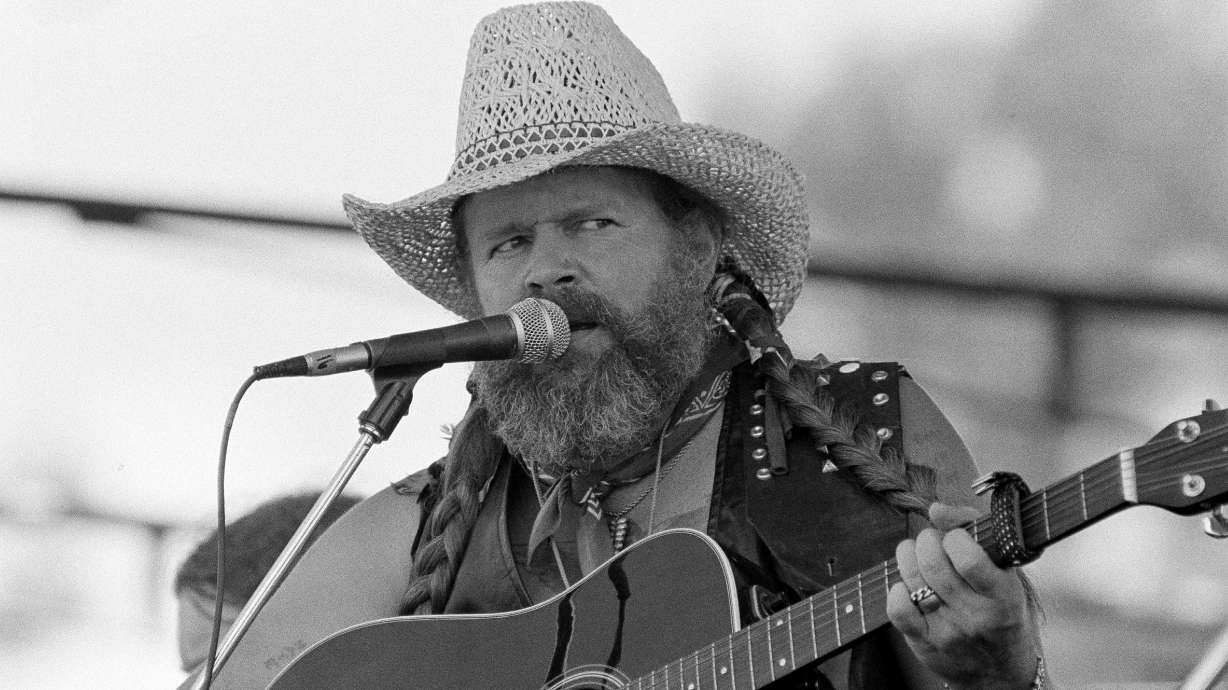 David Allan Coe, sporting Willie Nelson braids, performs at the Willie Nelson July 4th Picnic, on July 4, 1983 at Atlanta International Raceway in Hampton, Ga.