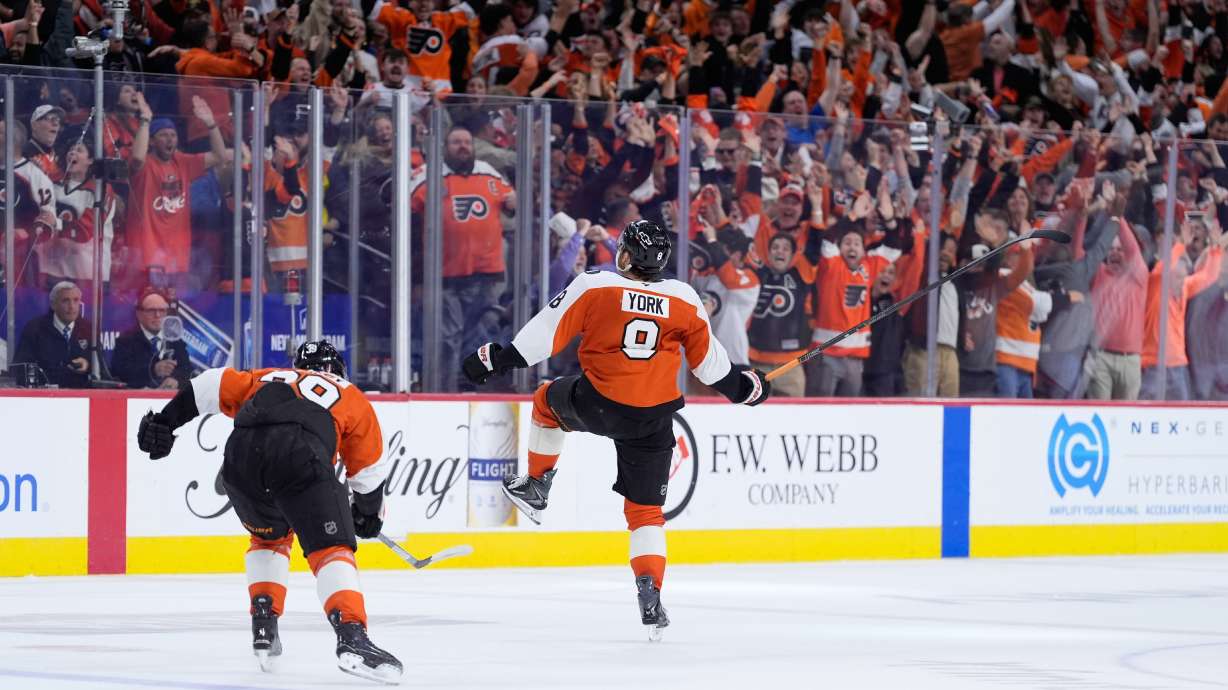 Philadelphia Flyers' Cam York (8) celebrates after scoring the game-winning goal during overtime in Game 6 against the Pittsburgh Penguins in the first round of the NHL hockey Stanley Cup playoffs series Wednesday, April 29, 2026, in Philadelphia.