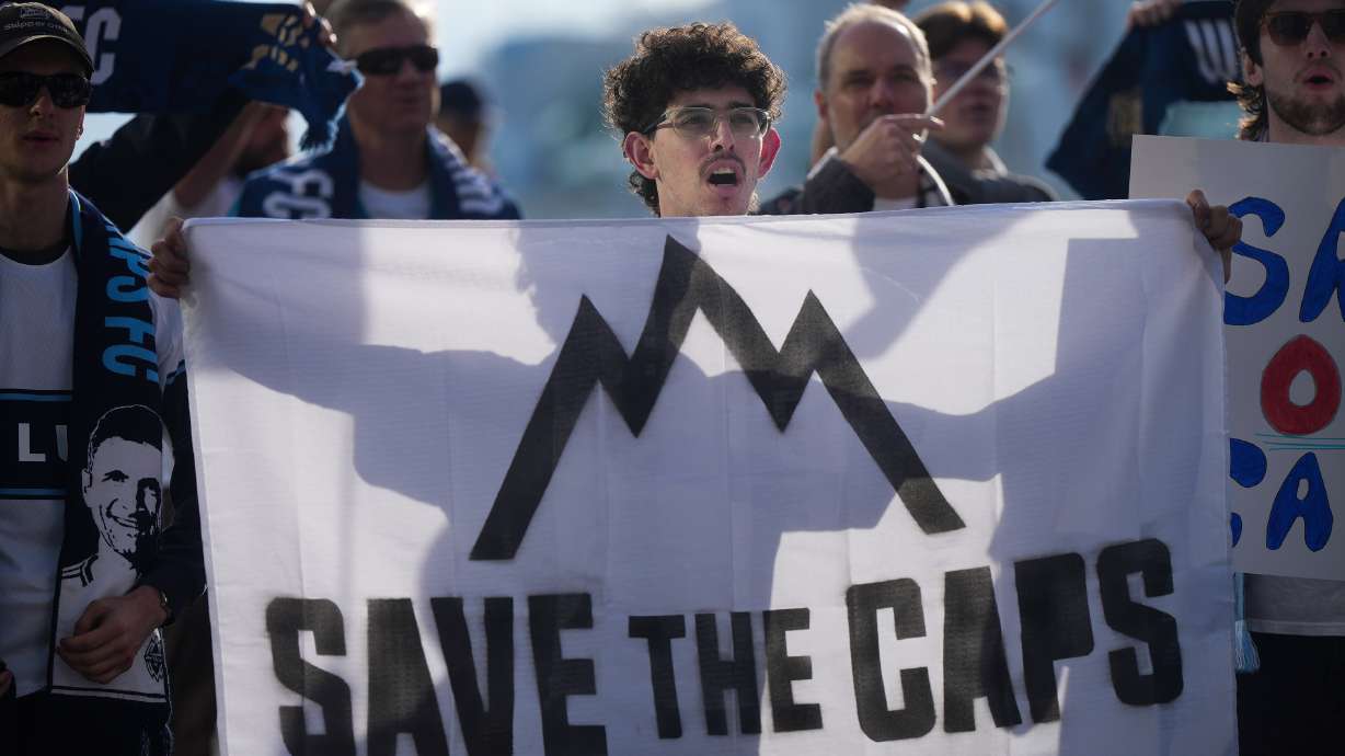 Fans of the Vancouver Whitecaps MLS soccer team rally to keep the team in Vancouver, Thursday, April 30, 2026, outside the 76th FIFA Congress in Vancouver, British Columbia.