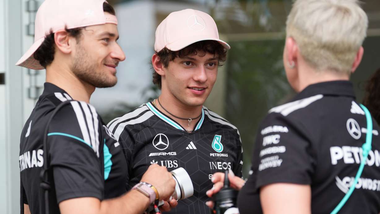 Mercedes driver Andrea Kimi Antonelli, center, of Italy, talks to team members outside a hospitality tent ahead of the Formula One Miami Grand Prix auto race, Thursday, April 30, 2026, in Miami Gardens, Fla.
