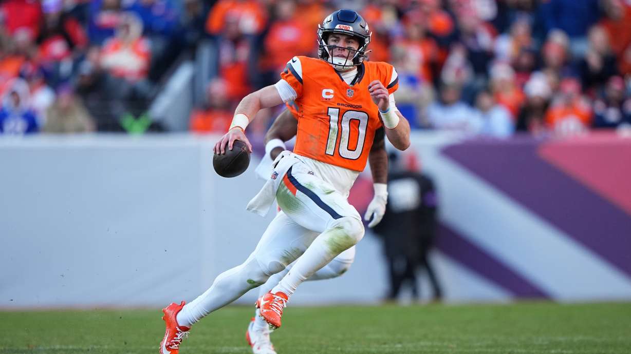 FILE - Denver Broncos quarterback Bo Nix (10) runs the ball against the Buffalo Bills in an NFL divisional playoff football game on Jan. 17, 2026 in Denver.