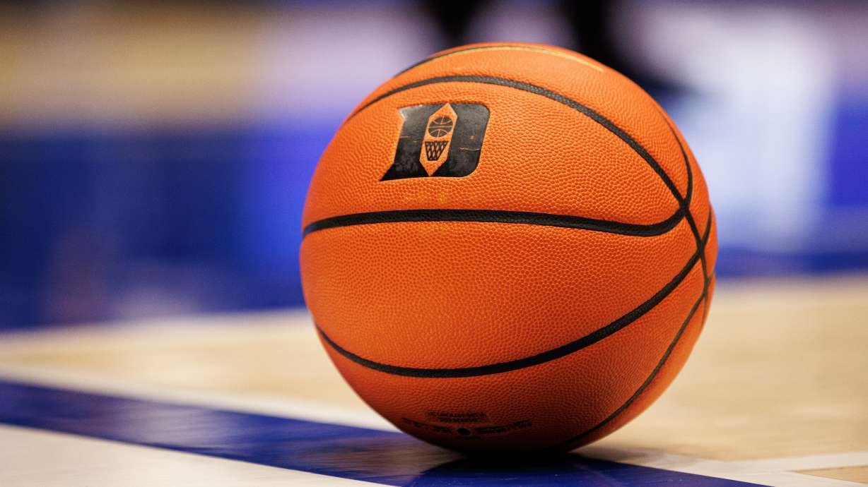 FILE - A basketball with the Duke logo sits on the court during a timeout in an NCAA college basketball game against in Durham, N.C., Dec. 16, 2025.
