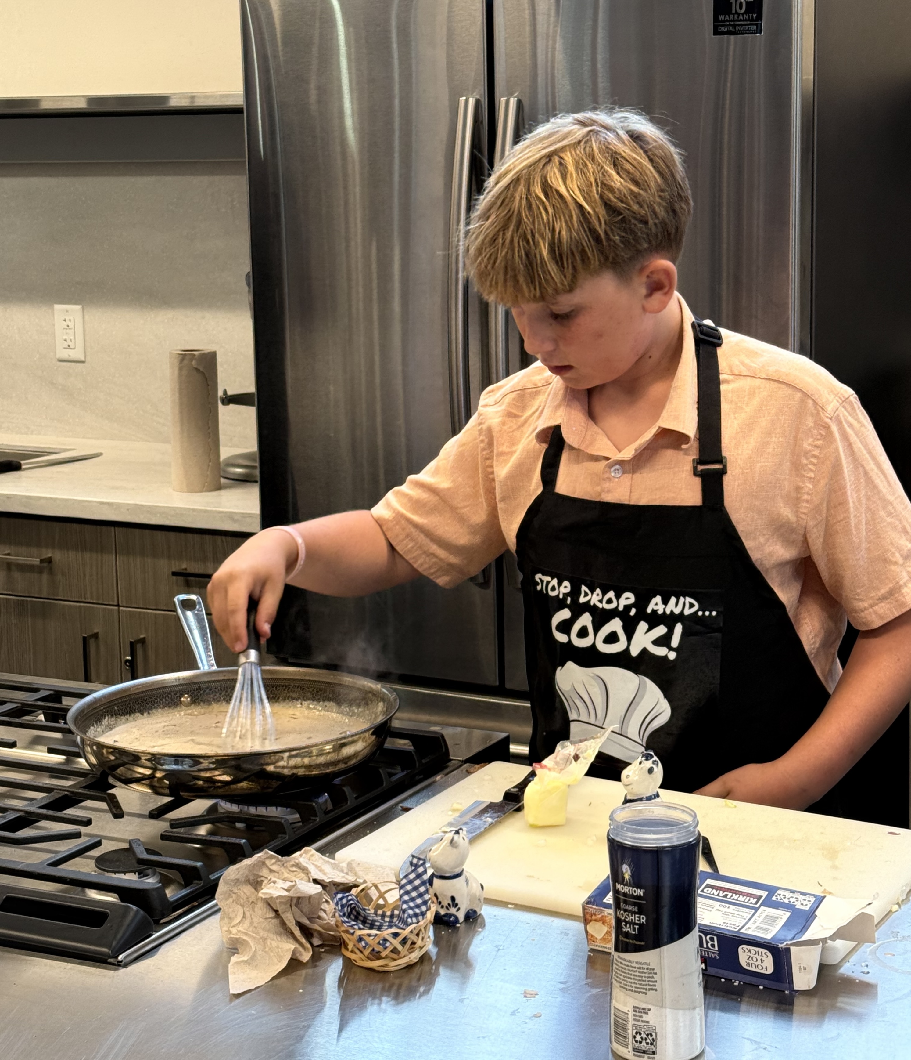 Salt Lake teen Merrill Oaks cooks pork chops for a youth cook-off at the Utah State Fair in September 2025.