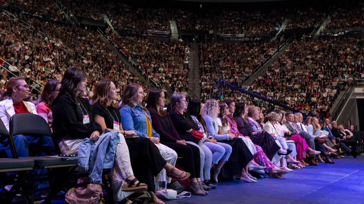 Attendees listen as Sheri Dew, executive vice president and chief content officer of Deseret Management Corporation, speaks during her keynote session as part of BYU Women's Conference held at the Marriott Center in Provo on Thursday.