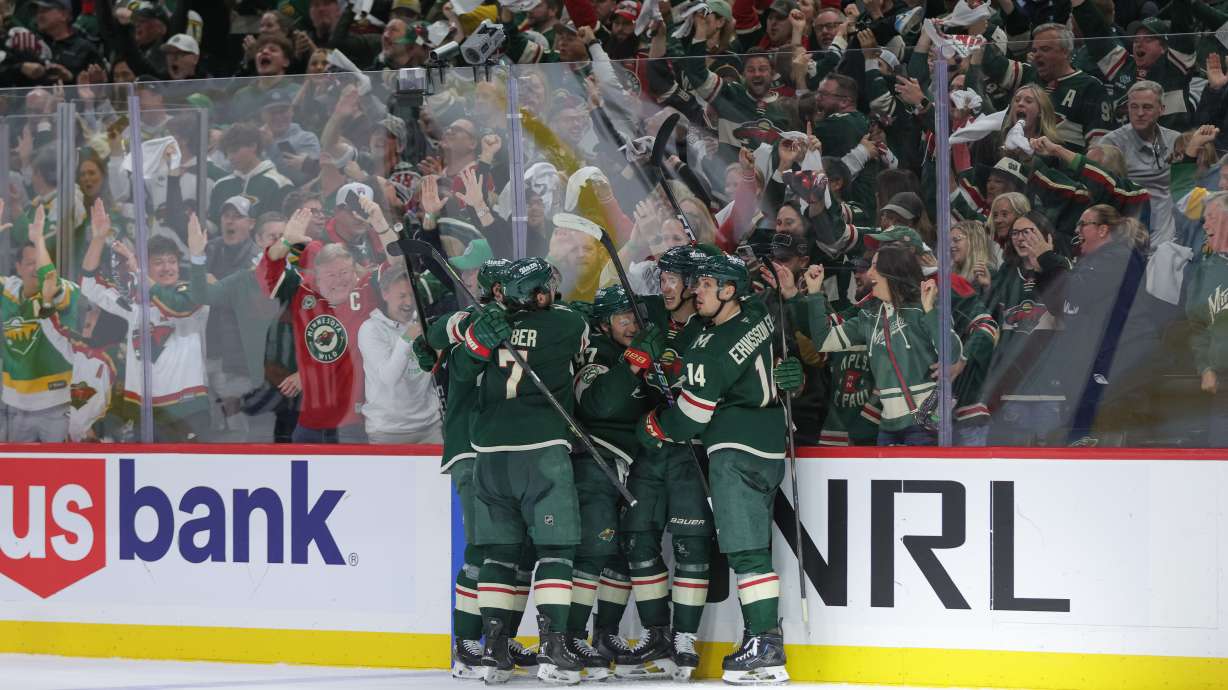 Minnesota Wild left wing Matt Boldy, second from the right, celebrates with teammates after scoring during the third period of Game 6 in the first round of the NHL hockey Stanley Cup playoff series against the Dallas Stars, Thursday, April 30, 2026, in St. Paul, Minn.