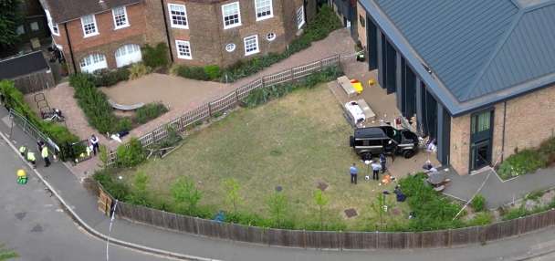 Driver who drove into a tea party outside a London school charged over death of 2 girls