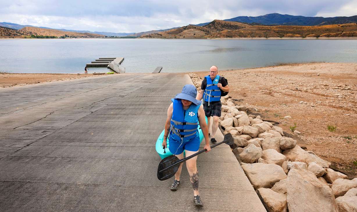 Annette and Randy Smith of Grantsville walk the elongated boat ramp after kayaking Echo Reservoir in Coalville on Aug. 22, 2025.