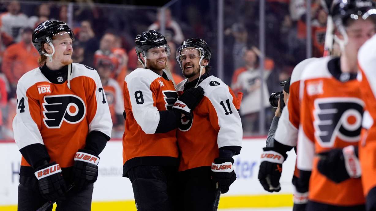 Philadelphia Flyers' Cam York (8) and Travis Konecny (11) celebrate after the Flyers won Game 6 against the Pittsburgh Penguins in the first round of the NHL hockey Stanley Cup playoffs series Wednesday, April 29, 2026, in Philadelphia.