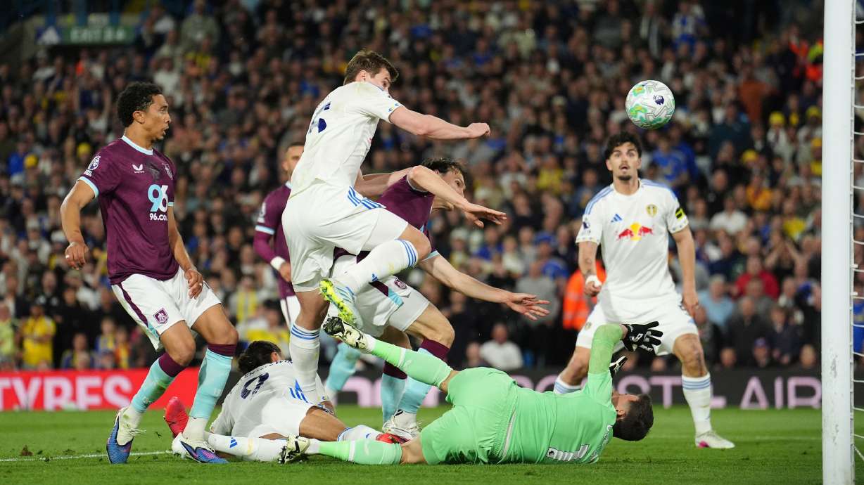 Leeds United's Dominic Calvert-Lewin, second from left, scores their side's third goal during the Premier League match between Leeds United and Burnley, in Leeds, England, Friday, May 1, 2026.