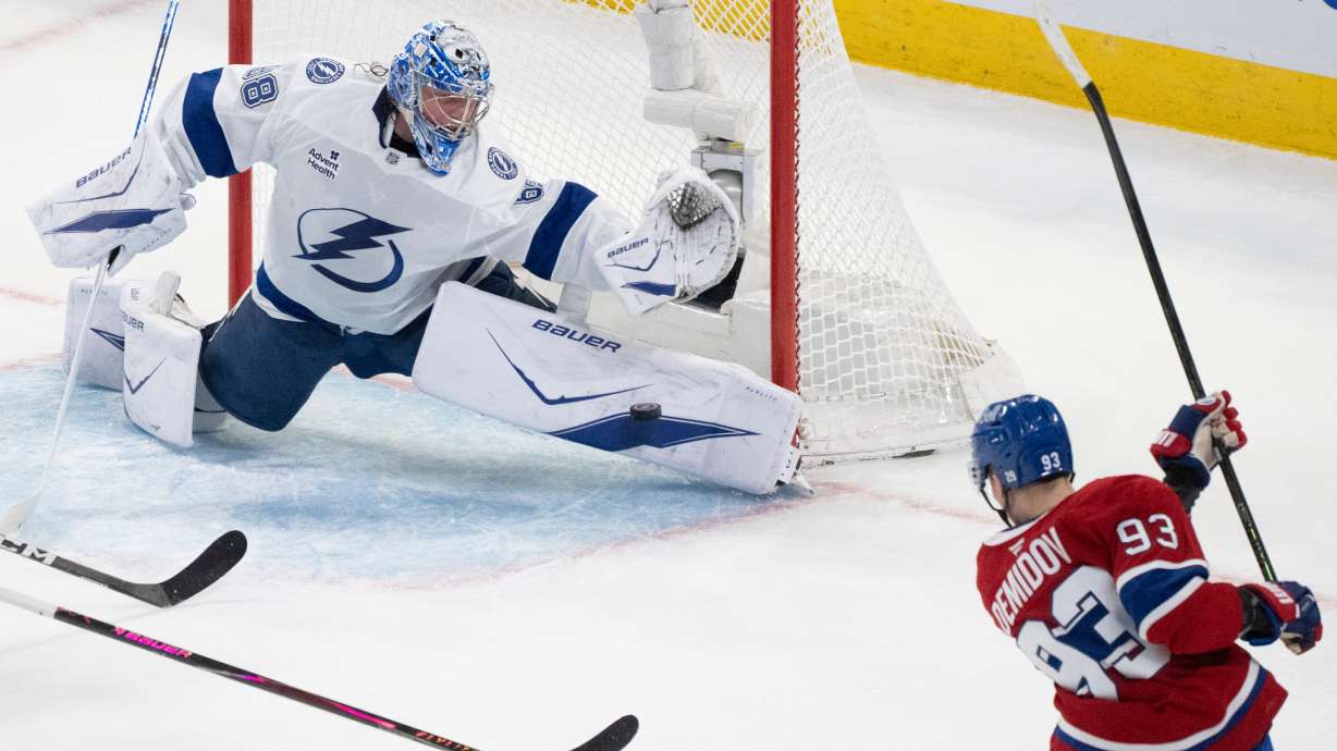 Tampa Bay Lightning goaltender Andrei Vasilevskiy (88) stops a shot by Montreal Canadiens' Ivan Demidov (93) during the second period of Game 6 in the first round of an NHL hockey Stanley Cup playoff series in Montreal, Friday, May 1, 2026.