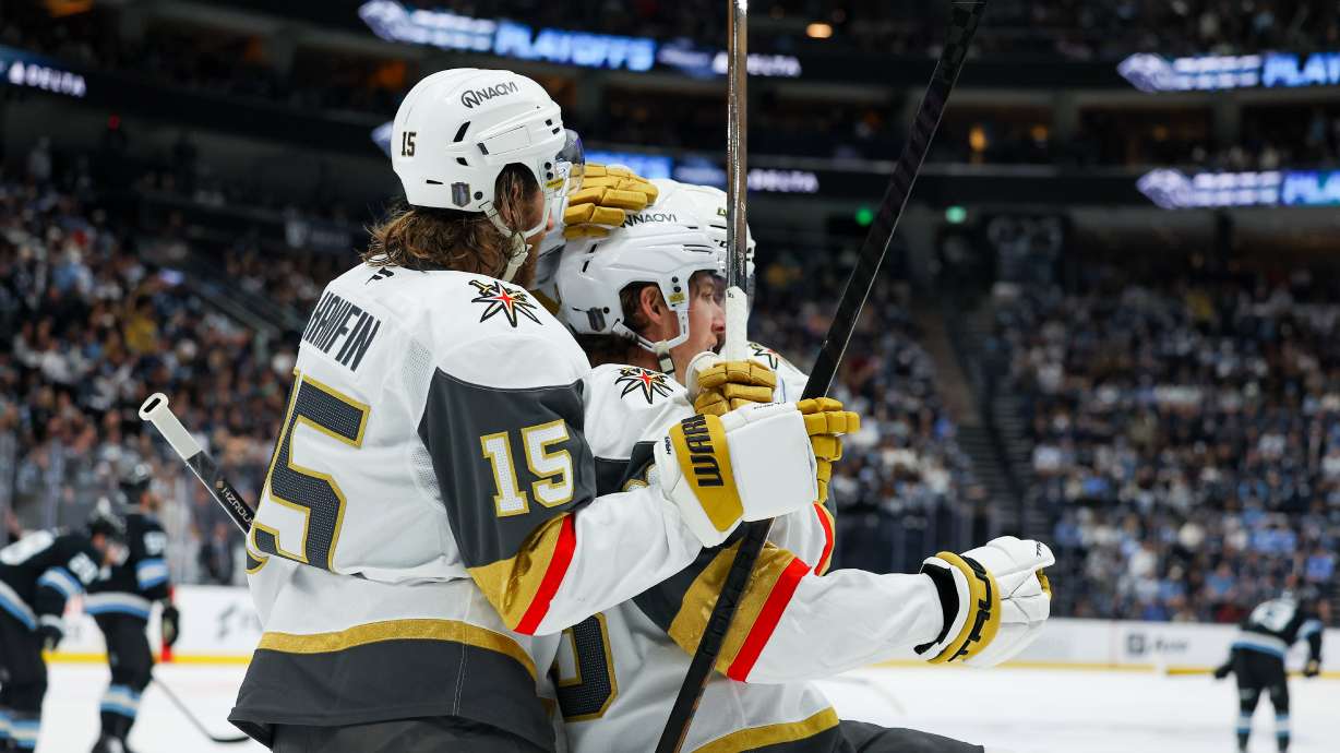 Vegas Golden Knights defenseman Noah Hanifin (15) and right wing Mitch Marner (93) celebrate a goal against the Utah Mammoth during the second period of Game 6 in the first round of an NHL hockey Stanley Cup playoff series, Friday, May 1, 2026, in Salt Lake City.