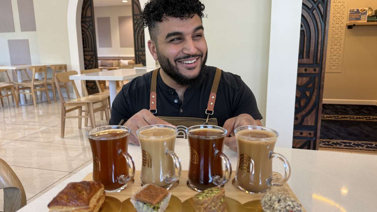 Franchisee Ahmad Badr serves a drink and treat sampler at Arwa Yemeni Coffee on April 6, in Sunnyvale, Calif.
