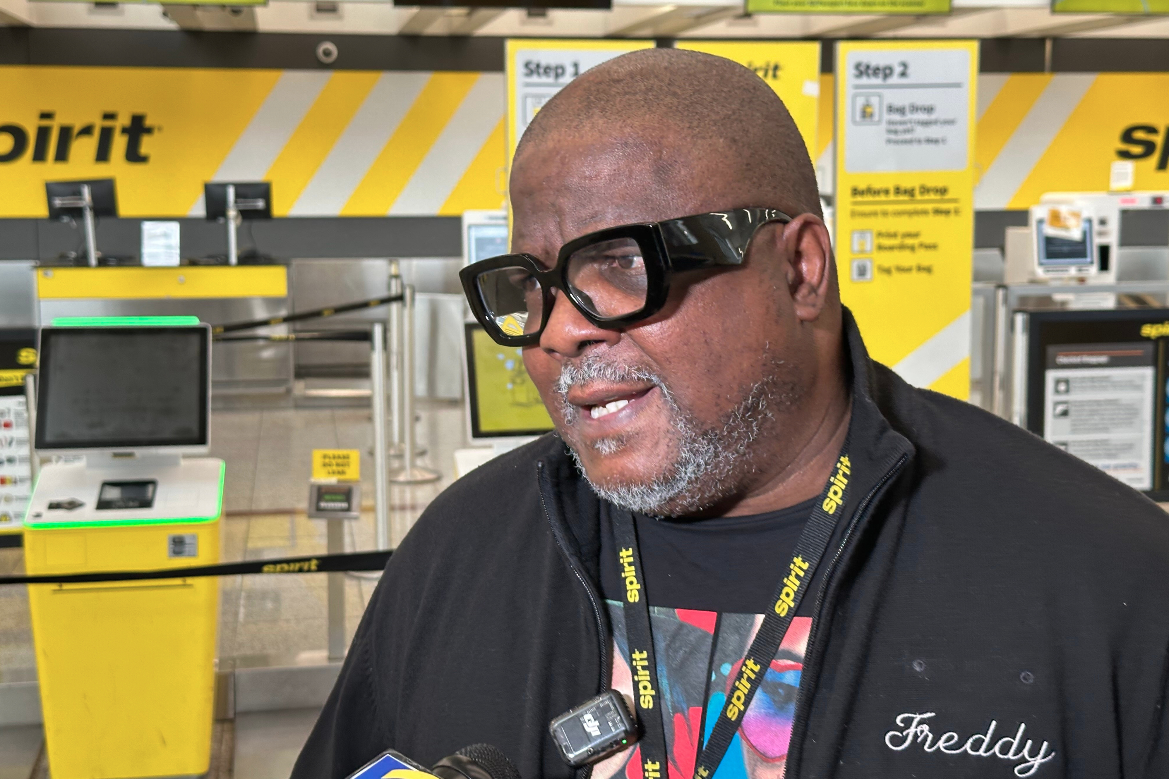 Laid-off Spirit Airlines flight attendant Freddie Peterson talks about the airline’s shutdown on Saturday at Hartsfield-Jackson Atlanta International Airport in Atlanta. Peterson said he had set his alarm clock for 3 a.m. for developments on the cessation of the airline.