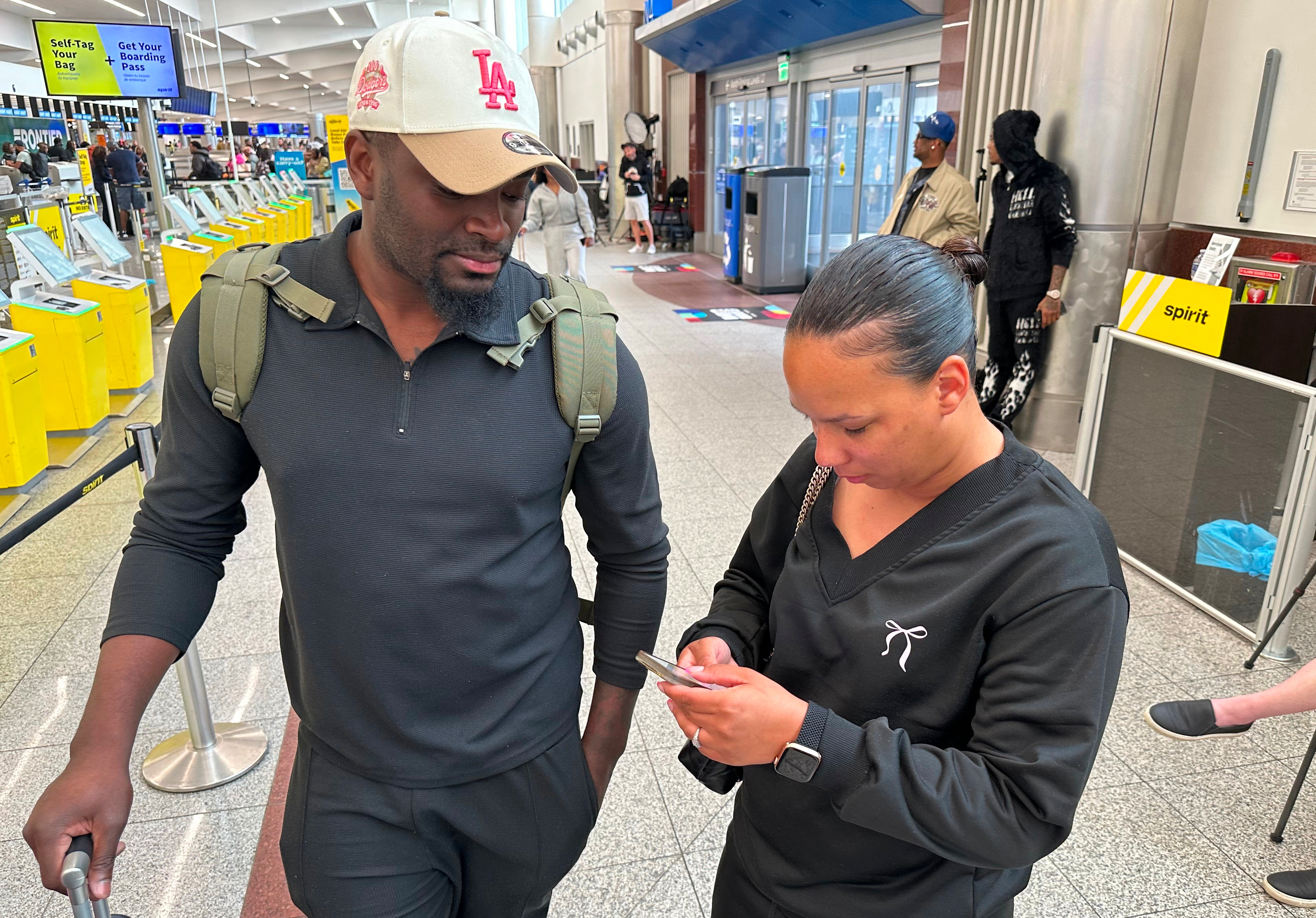 Taylor Nantang and her husband learn of Spirit Airlines’ shutdown on Saturday at Hartsfield-Jackson Atlanta International Airport in Atlanta. The Nantangs were among the many stunned at the airline's sudden shutdown.