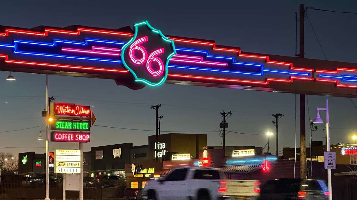 Traffic passes under a neon Route 66 sign on the west end of Albuquerque, New Mexico, Jan. 16.