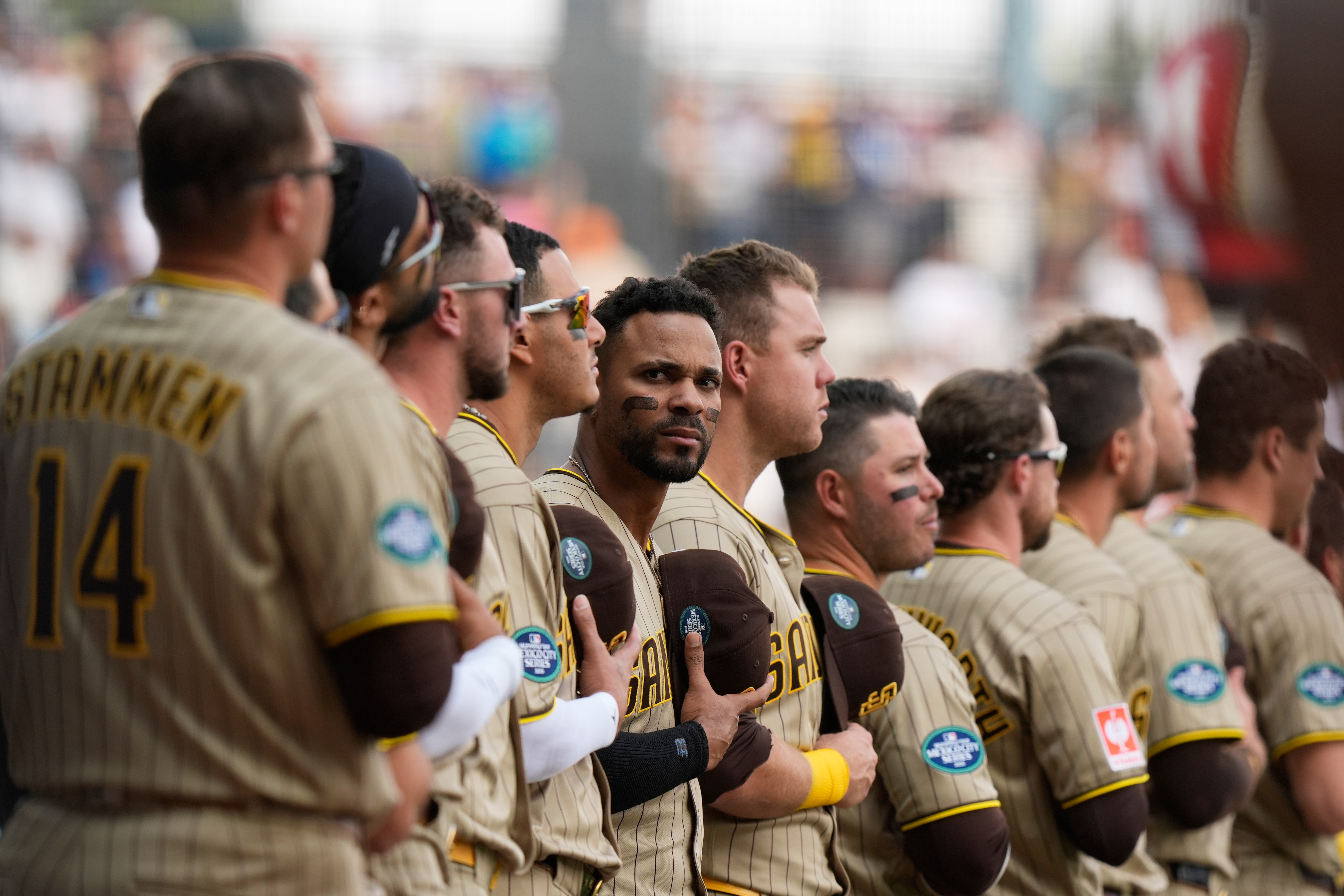 San Diego Padres' Xander Bogaerts, center, and teammate stand line prior to a baseball game against Arizona Diamondbacks in Mexico City, Saturday, April 25, 2026. 