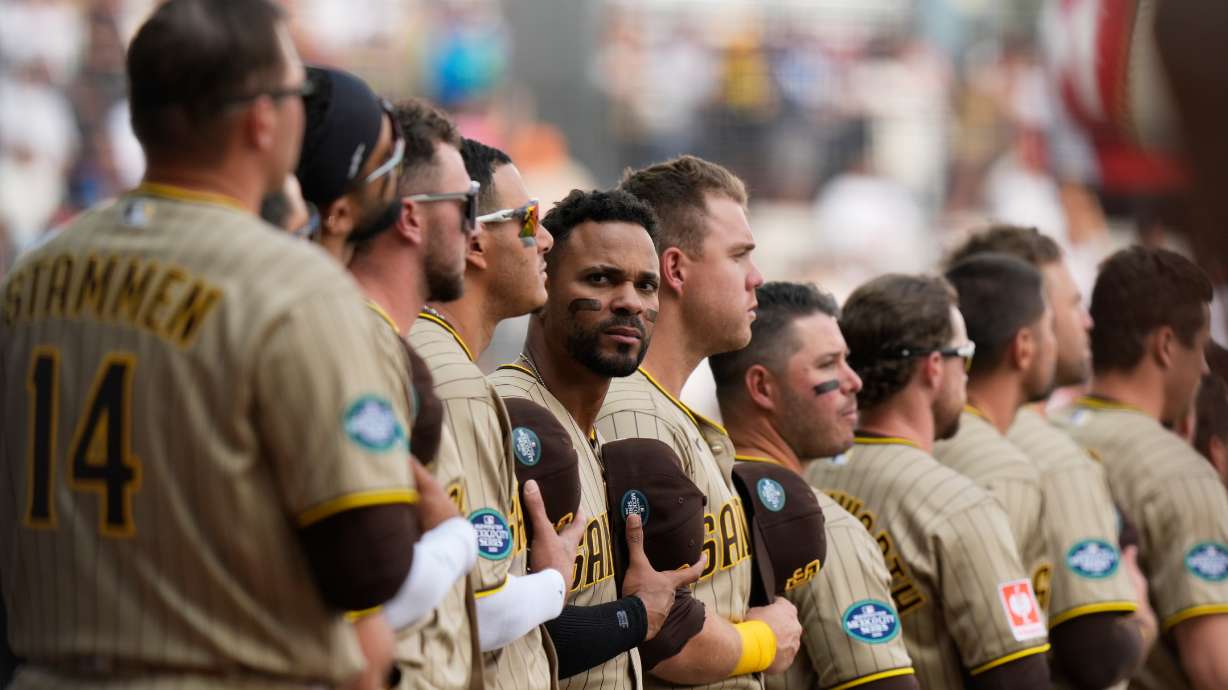 San Diego Padres' Xander Bogaerts, center, and teammate stand line prior to a baseball game against Arizona Diamondbacks in Mexico City, Saturday, April 25, 2026.