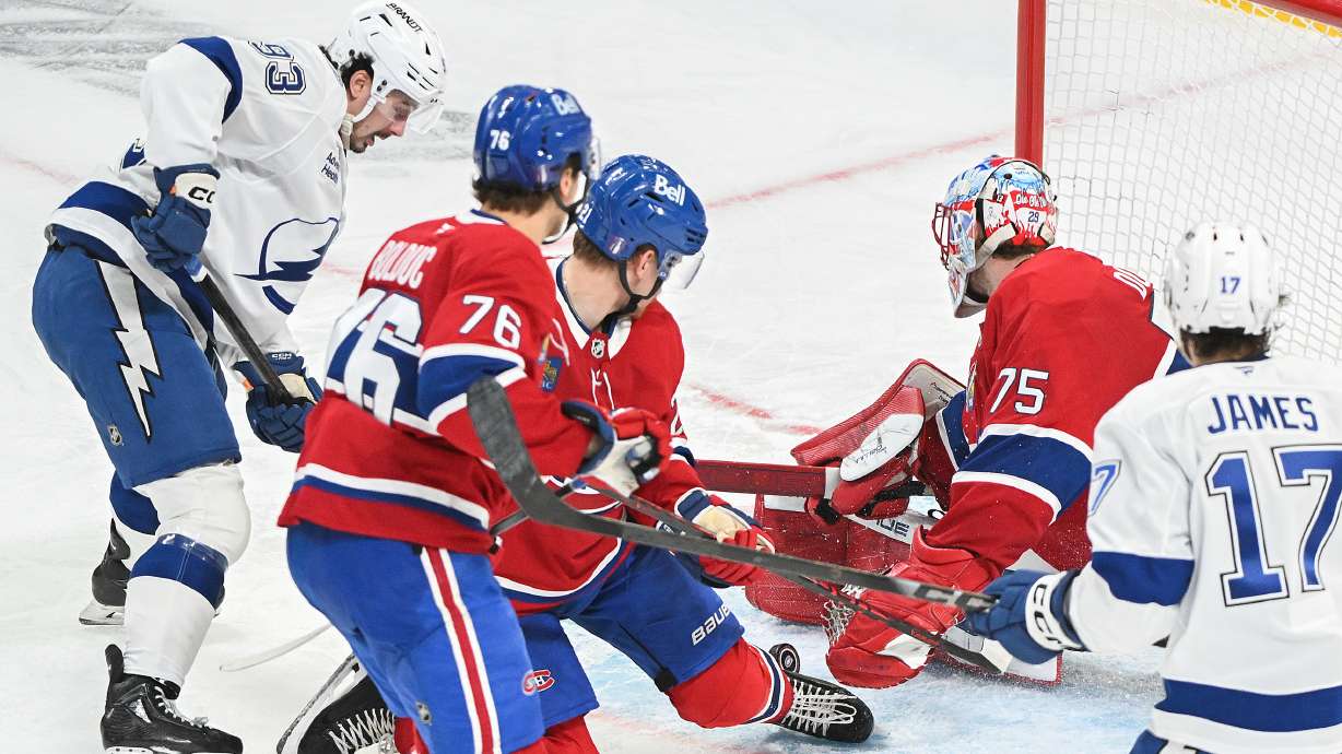 Tampa Bay Lightning's Gage Goncalves (93) scores against Montreal Canadiens goaltender Jakub Dobes (75) during overtime of Game 6 in the first round of an NHL hockey Stanley Cup playoff series in Montreal, Friday, May 1, 2026.