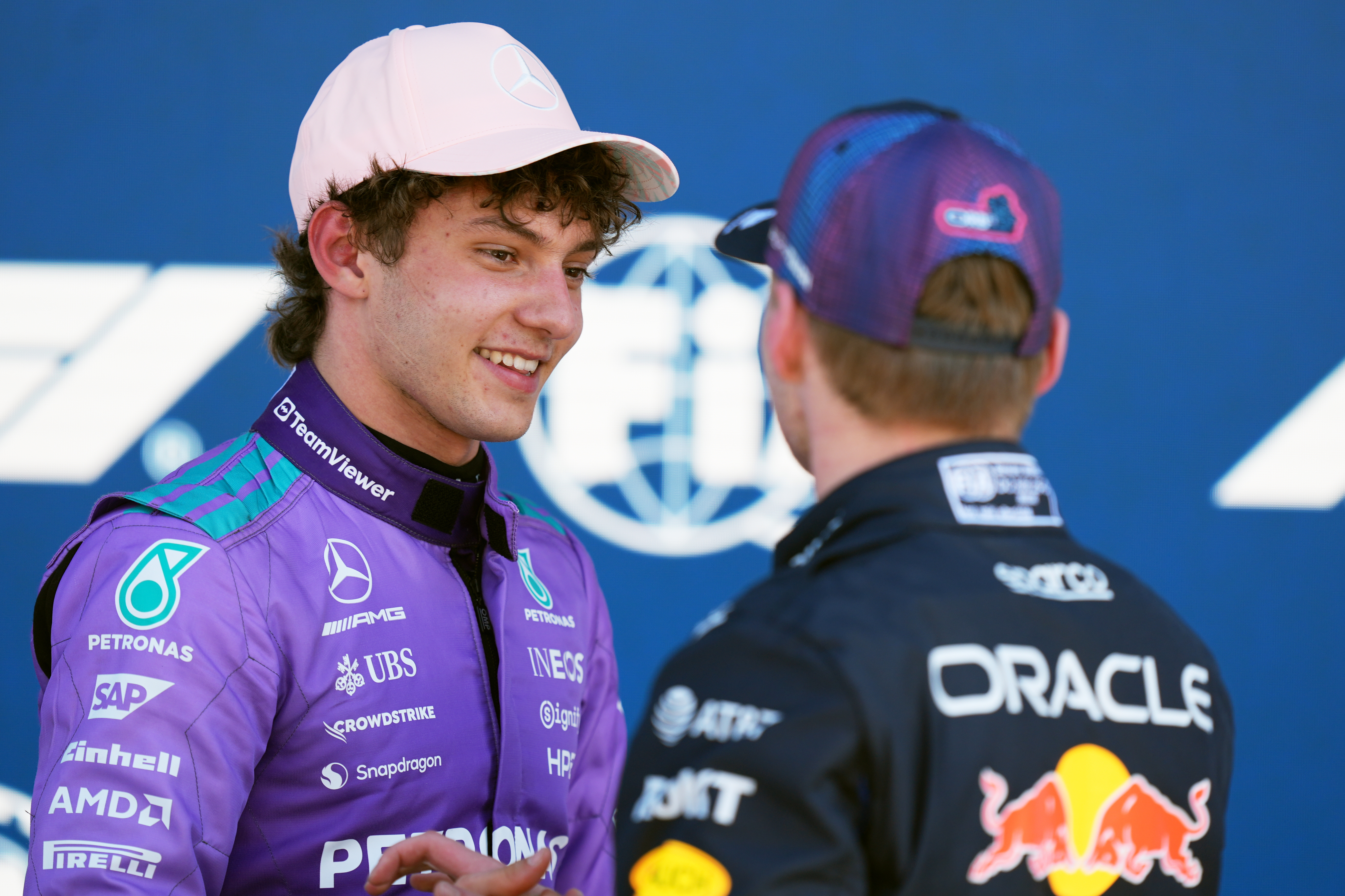 Mercedes driver Kimi Antonelli of Italy talks with Red Bull driver Max Verstappen of the Netherlands after a qualifying session for the Miami Formula One Grand Prix auto race, Saturday, May 2, 2026, in Miami Gardens, Fla. 
