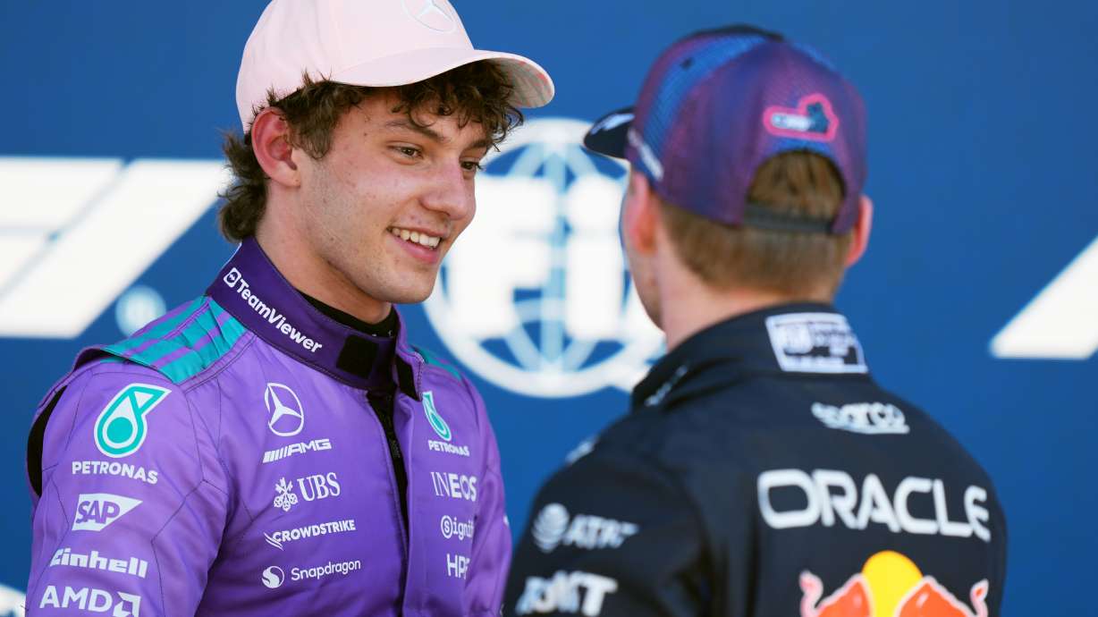 Mercedes driver Kimi Antonelli of Italy talks with Red Bull driver Max Verstappen of the Netherlands after a qualifying session for the Miami Formula One Grand Prix auto race, Saturday, May 2, 2026, in Miami Gardens, Fla.