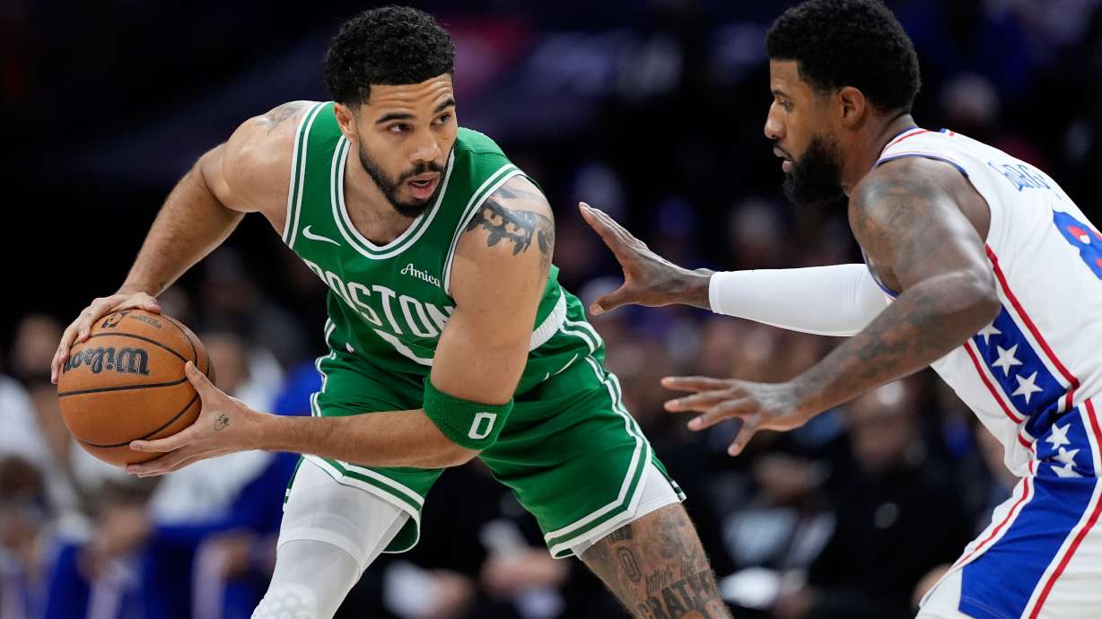 Boston Celtics' Jayson Tatum, left, tries to get past Philadelphia 76ers' Paul George during the first half of Game 6 in a first-round NBA basketball playoff series Thursday, April 30, 2026, in Philadelphia.