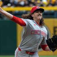 The Reds tie an MLB record by walking 7 straight batters in a 17-7 loss to the Pirates
