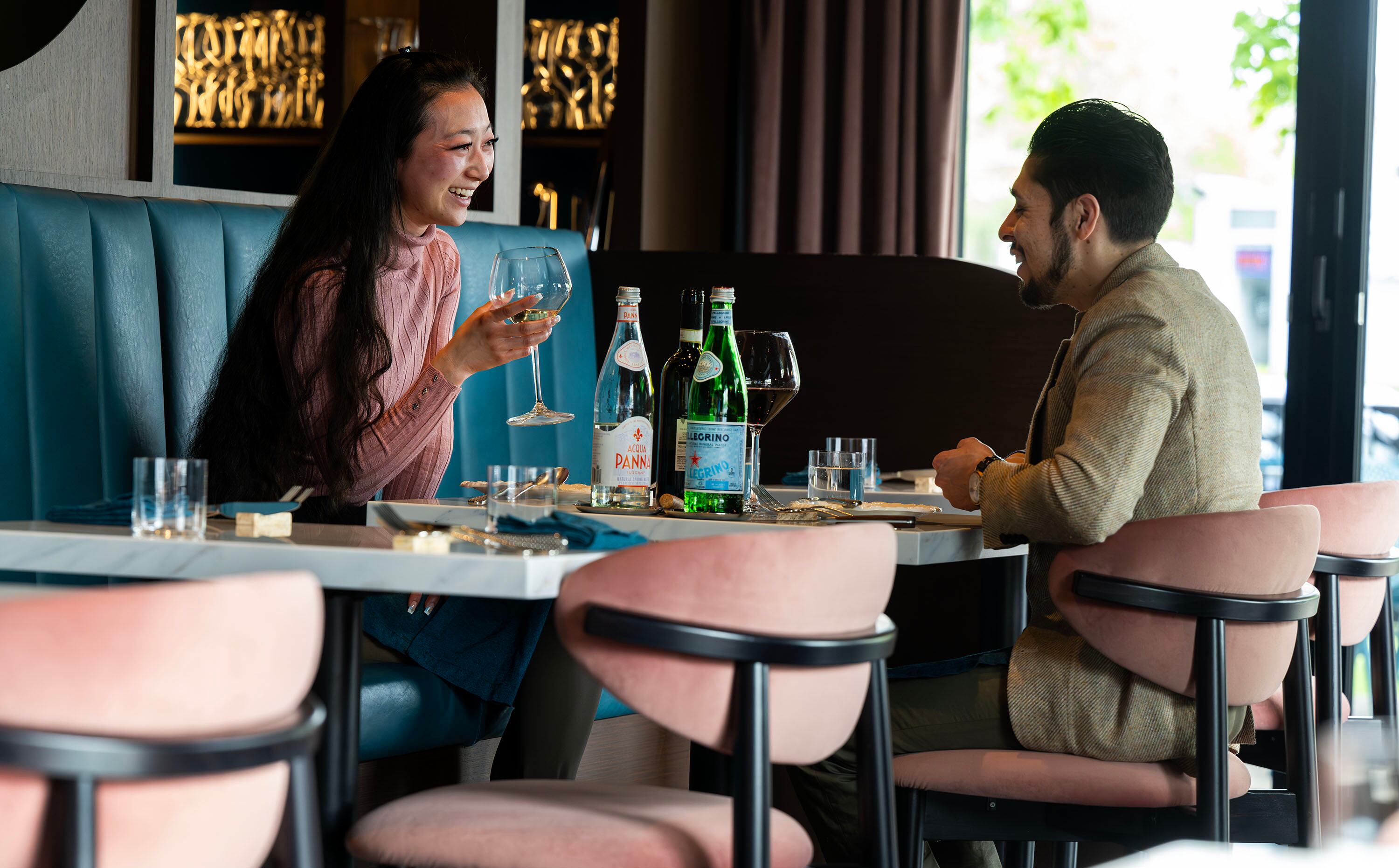 Gina Kunihiro and Alexander Montero enjoy a conversation before their meal at Mina, a new Sicilian-inspired Italian restaurant, in Salt Lake City on Wednesday. Co-owner Adam Rosh said guests are always impressed with how nice and pleasant the space is.