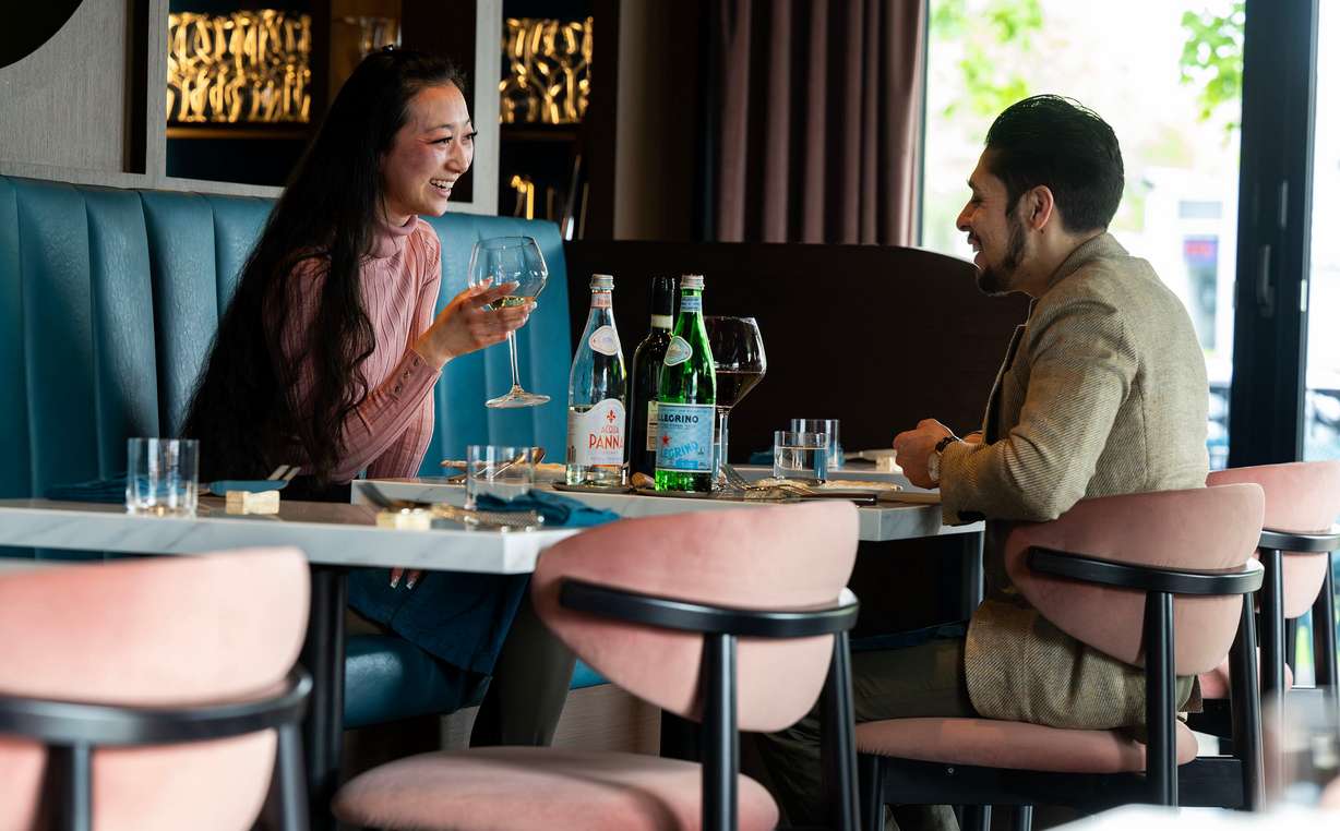 Gina Kunihiro and Alexander Montero enjoy a conversation before their meal at Mina, a new Sicilian-inspired Italian restaurant, in Salt Lake City on Wednesday. Co-owner Adam Rosh said guests are always impressed with how nice and pleasant the space is.