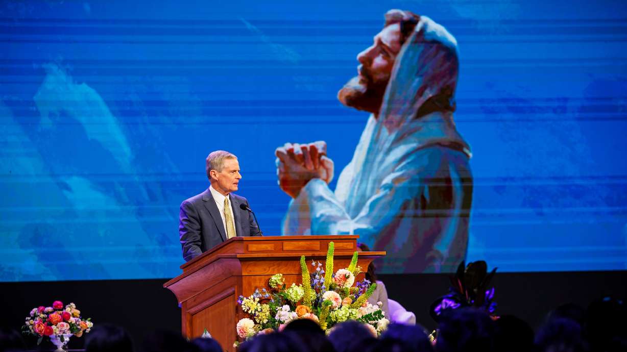 Elder David A. Bednar of the Quorum of the Twelve Apostles speaks in the Marriott Center in Provo for the BYU Women’s Conference on Friday. Elder Bednar reflected with his wife, Susan, on those affected by the Michigan meetinghouse attack.