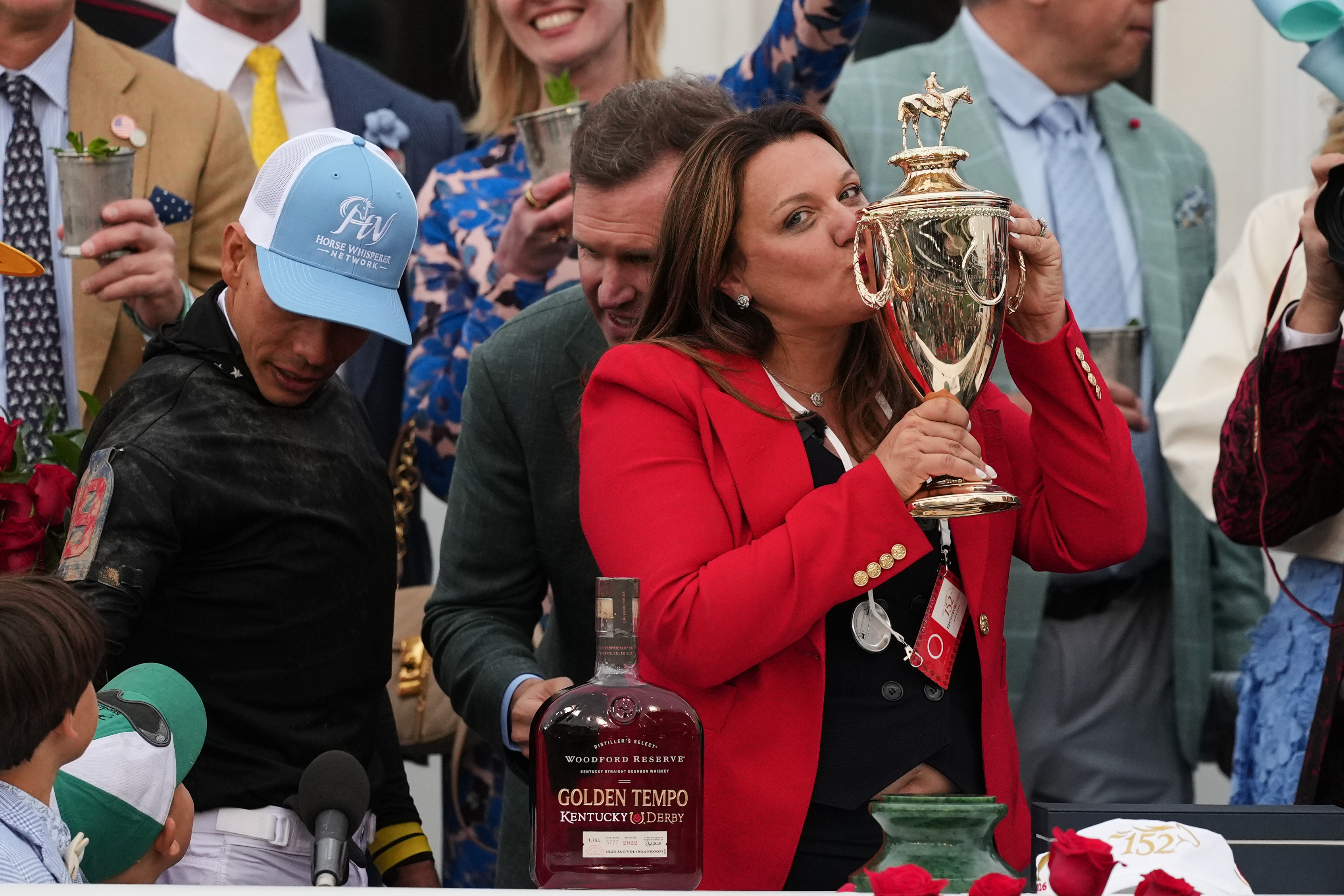 Trainer Cherie DeVaux kisses the trophy after a victory by Golden Tempo in the 152nd running of the Kentucky Derby horse race at Churchill Downs, Saturday, May 2, 2026, in Louisville, Ky.