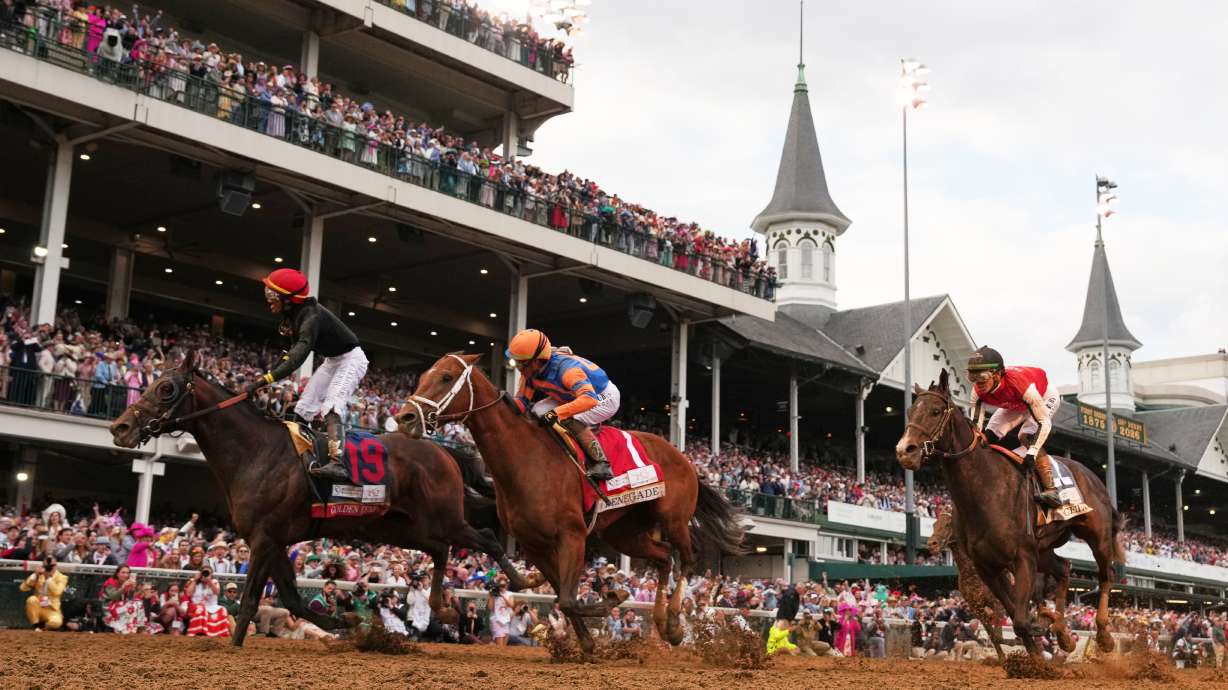 Jockey Jose L. Ortiz celebrates after riding Golden Tempo (19) to victory the 152nd running of the Kentucky Derby horse race at Churchill Downs, Saturday, May 2, 2026, in Louisville, Ky.