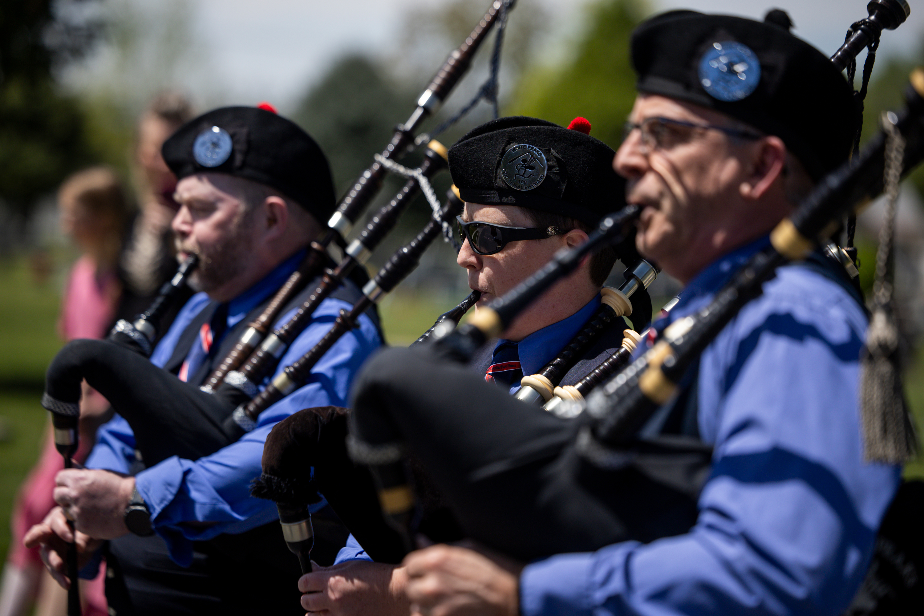The White Peaks Centennial Pipe Band leads the hearse carrying the casket of Alan Osmond into the Spanish Fork City Cemetery in Spanish Fork on Saturday. The graveside ceremony combined solemn tradition with unexpected spectacle.