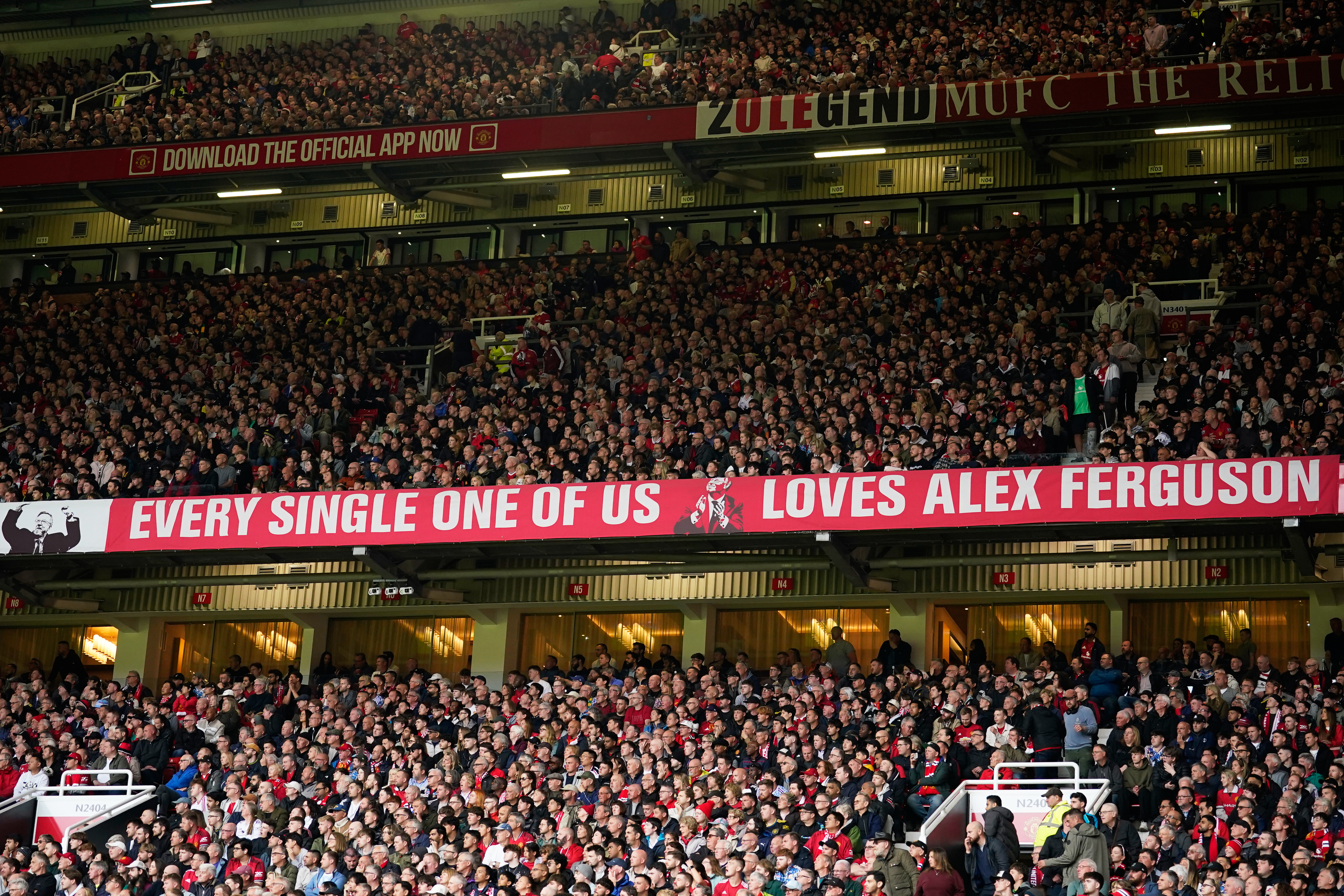 Manchester United fans cheer during the English Premier League soccer match between Manchester United and Liverpool in Manchester, England, Sunday, May 3, 2026. 