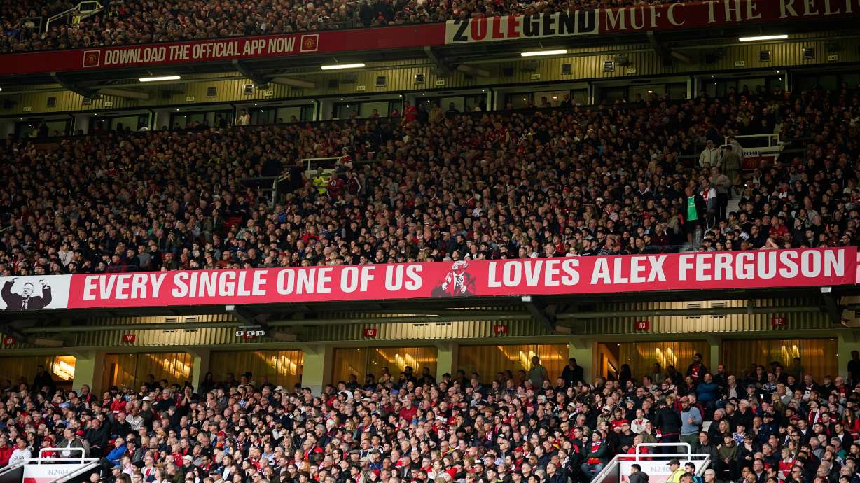 Manchester United fans cheer during the English Premier League soccer match between Manchester United and Liverpool in Manchester, England, Sunday, May 3, 2026.