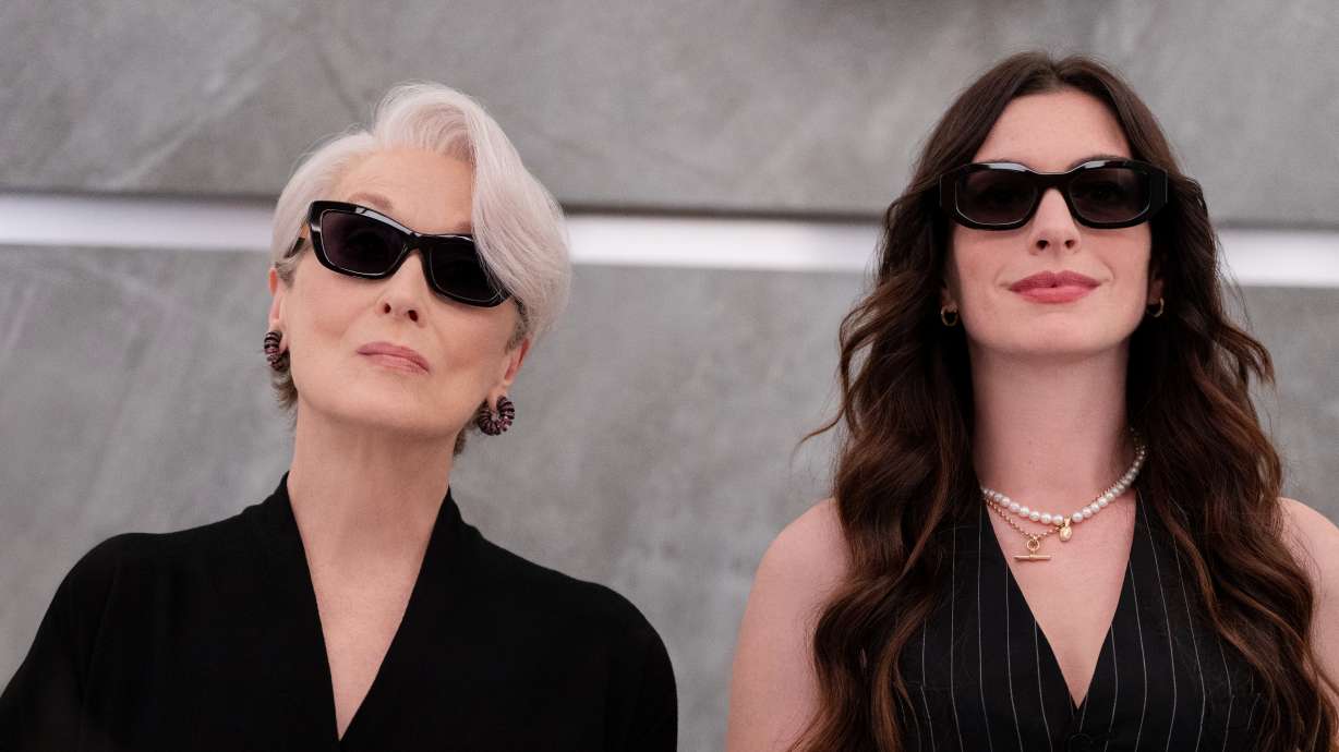 This image released by 20th Century Studios shows Meryl Streep, left, and Anne Hathaway in a scene from "The Devil Wears Prada 2." The movie made $77 million in the U.S. and Canada in its opening weekend.