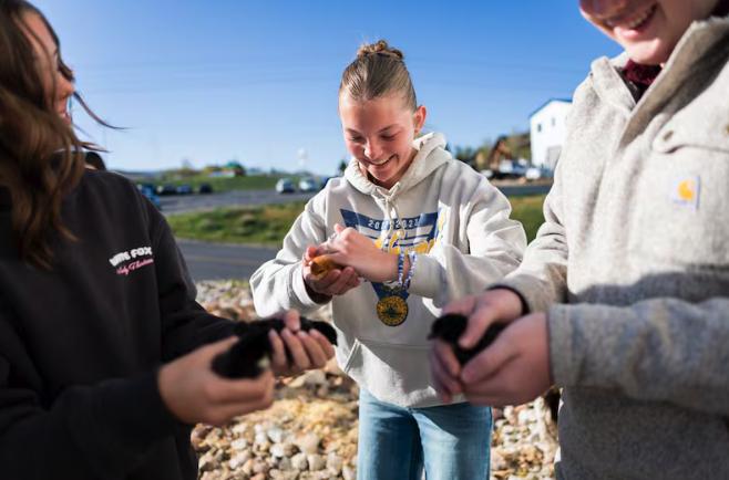 North Summit High School students Morgan Lefler, 15, Aspen Silcox, 15, and Graydon Pace, 15, from left, care for chicks during their animal science class as part of the agriculture program in the school's chapter of the National FFA Organization at North Summit High School in Coalville on Wednesday.