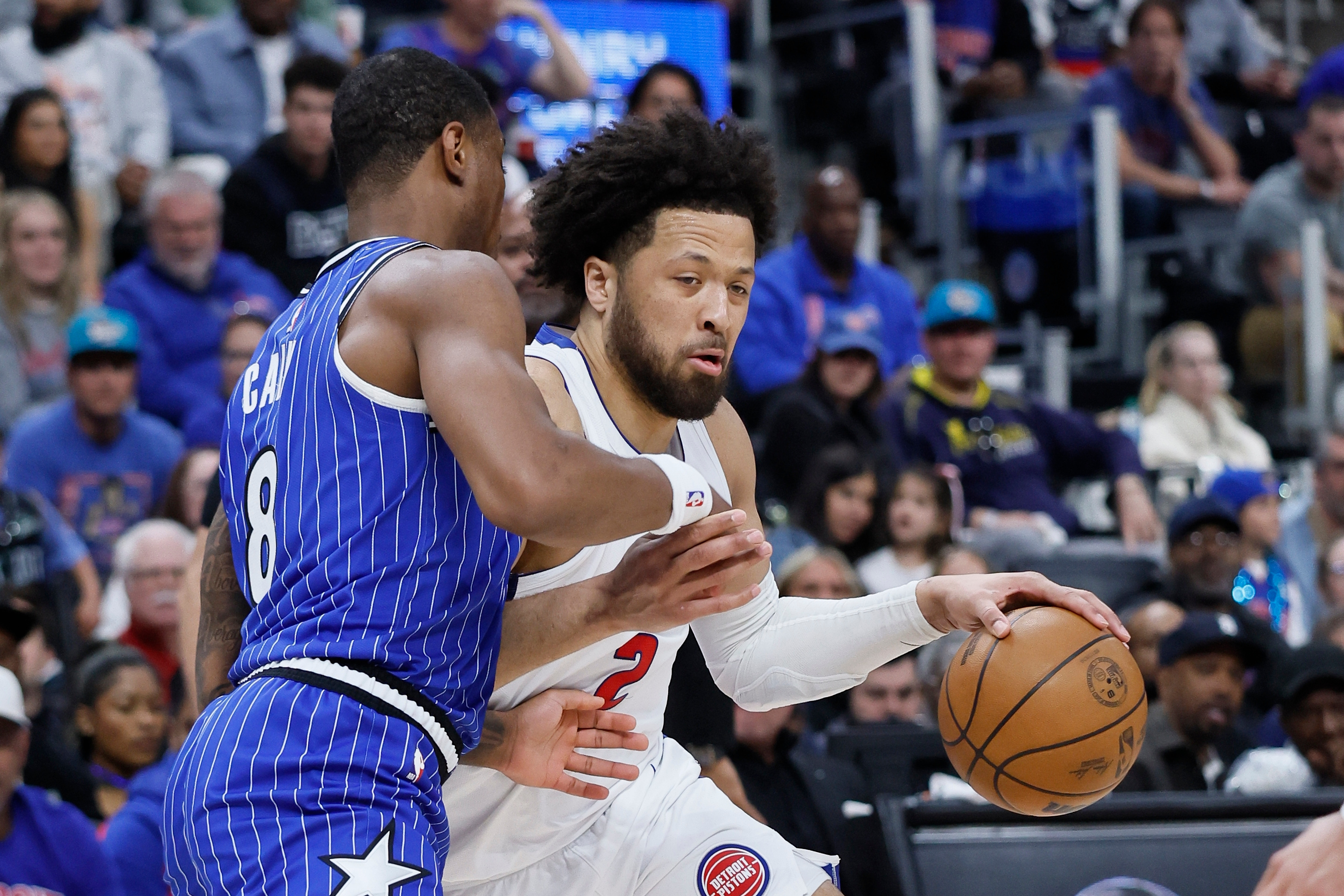 Detroit Pistons guard Cade Cunningham (2) drives against Orlando Magic forward Jamal Cain (8) during the first half in Game 7 of a first-round NBA basketball playoffs series Sunday, May 3, 2026, in Detroit. 