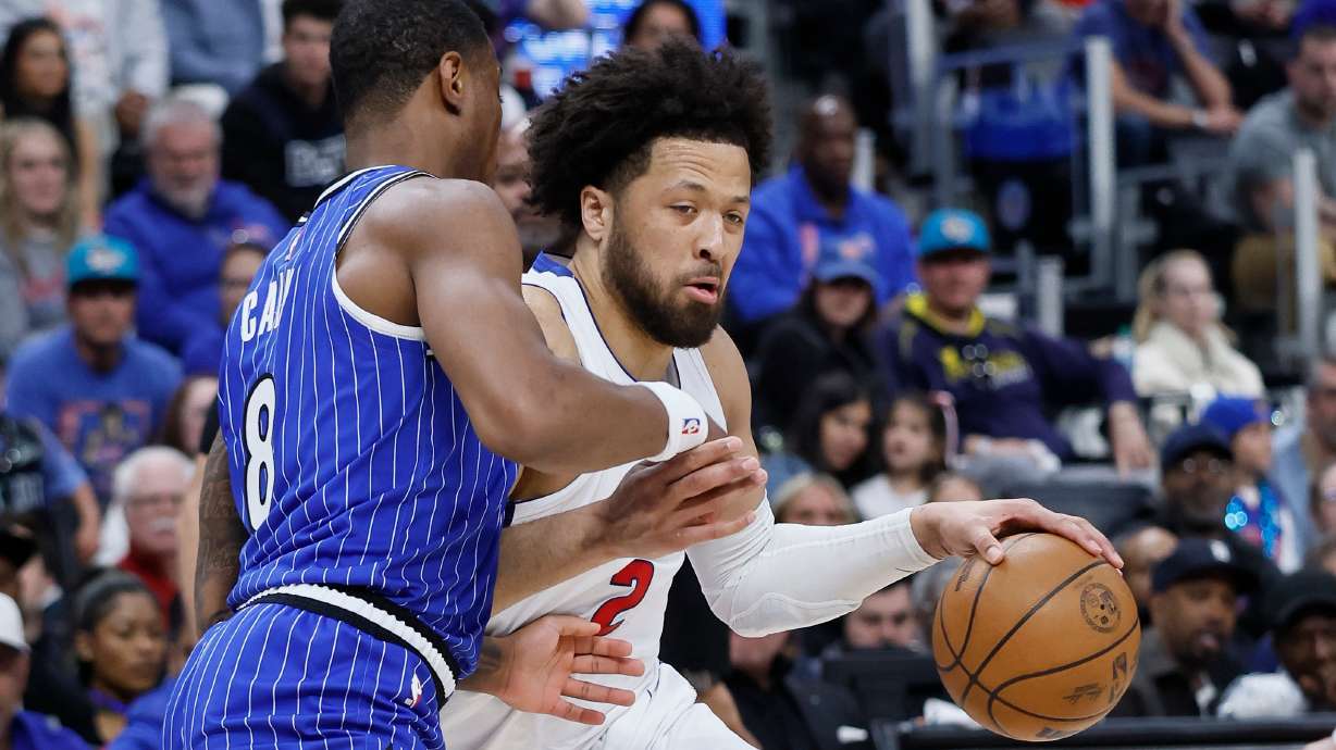 Detroit Pistons guard Cade Cunningham (2) drives against Orlando Magic forward Jamal Cain (8) during the first half in Game 7 of a first-round NBA basketball playoffs series Sunday, May 3, 2026, in Detroit.